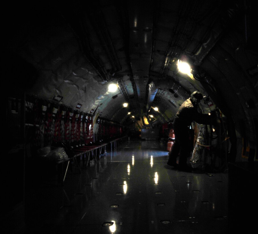 Tech. Sgt. Matthew Cain, 459th Aircraft Maintenance Squadron crew chief, conducts a preflight checklist on a KC-135 Stratotanker, March 25, 2013 at Joint Base Andrews, Md.  During inclimate weather conditions, maintainers take extra precautions when working on the flightline. (U.S. Air Force photo/Airman 1st Class Erin O’Shea)   