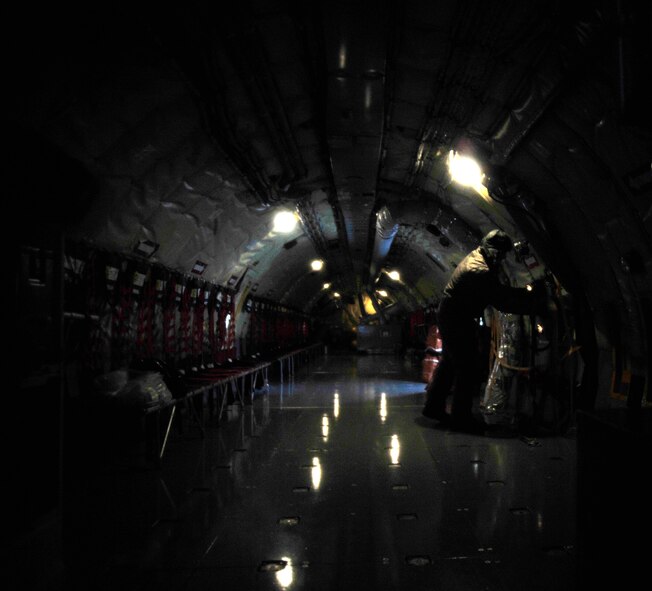 Tech. Sgt. Matthew Cain, 459th Aircraft Maintenance Squadron crew chief, conducts a preflight checklist on a KC-135 Stratotanker, March 25, 2013 at Joint Base Andrews, Md.  During inclimate weather conditions, maintainers take extra precautions when working on the flightline. (U.S. Air Force photo/Airman 1st Class Erin O’Shea)   