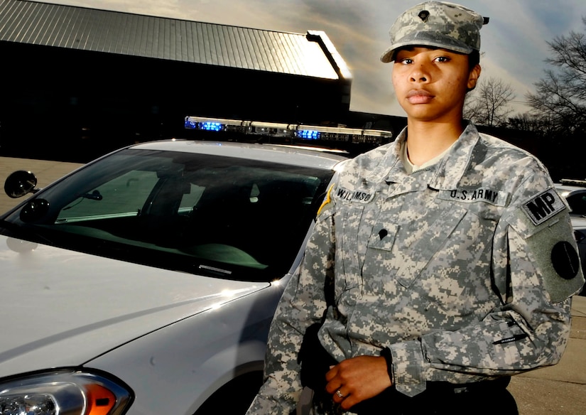 U.S. Army Spc. Adrianna Williamson, 221st Military Police Detachment patrolman, poses for a portrait at Fort Eustis, Va., March 20, 2013. Williamson is one of many women in the military continuing to make strides and fill critical roles. (U.S. Air Force photo by Staff Sgt. Wesley Farnsworth/Released)