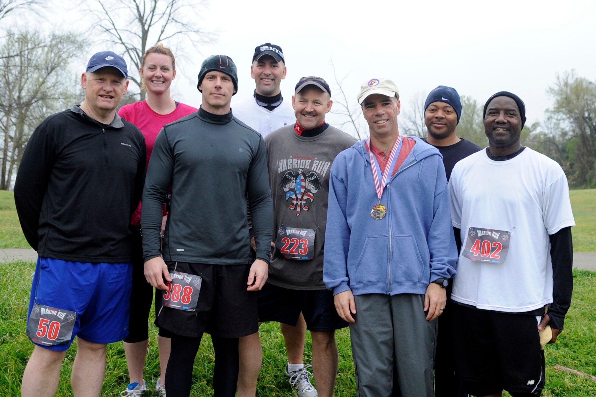 Doug McClain (#50), Erika Cordes, Bryan Bursiek (#388), Mike Kimbrel, James Marks (#223), Kenneth Rose, Norman Ford, and Melvin Banks (#402) pose for a photo after completing the Veteran’s Memorial Warrior Run and Healthwalk at Veteran’s Park in Shreveport, La., March 23, 2013. Rose won his age group (45 to 54) with an official time of 41:37. Each competitor pictured is a Reservist assigned to 307th Bomb Wing or 917th Fighter Group at Barksdale Air Force Base, La. (U.S. Air Force photo by Master Sgt. Jeff Walston)