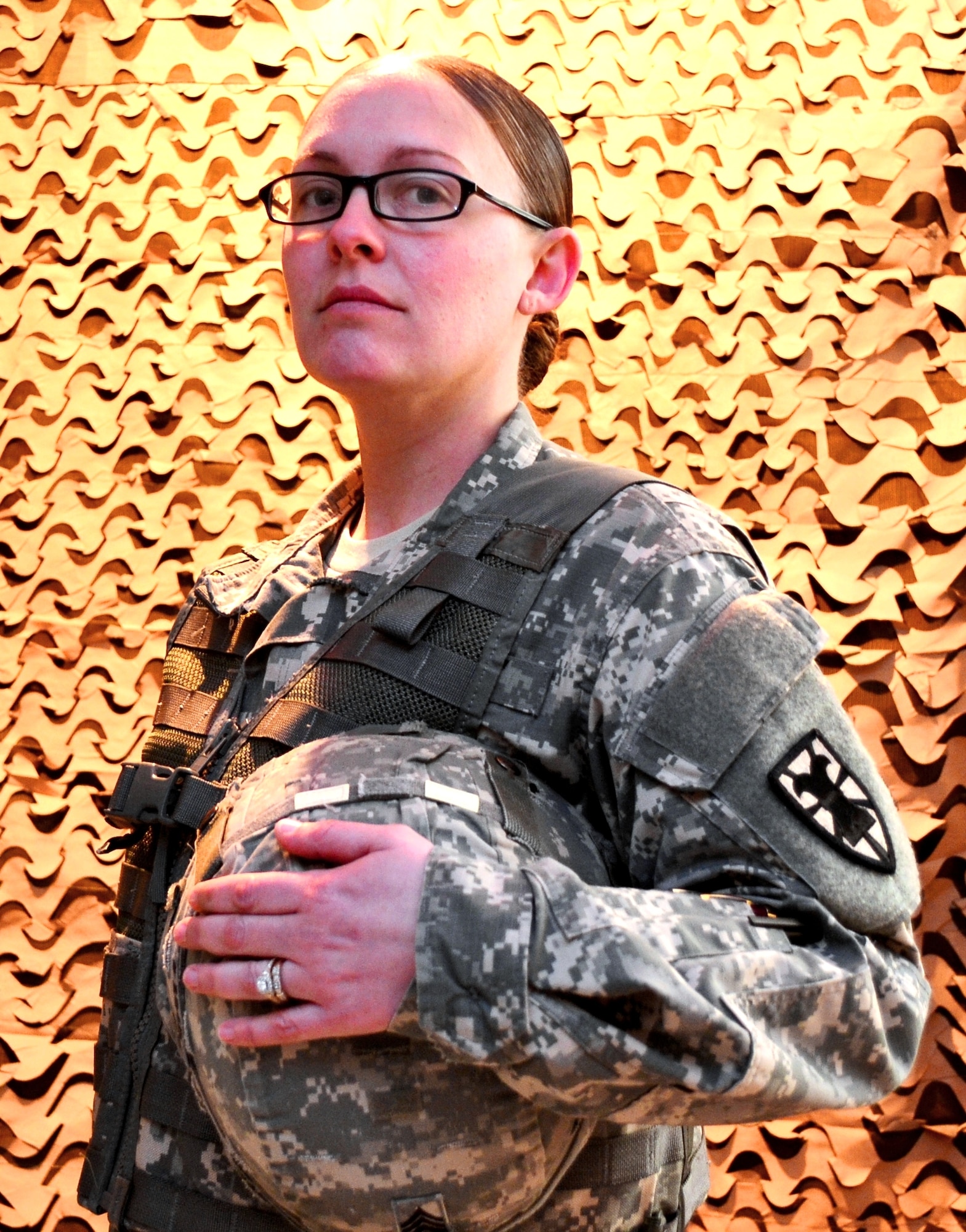 U.S. Army Staff Sgt. Cassandra Partee, 53rd Movement Control Battalion Headquarters command team administrator, has fought on the front lines in her two deployments to Iraq. Partee said it was no surprise to her when, in one of his final decisions as Secretary of Defense, Leon Panetta announced the lifting of rules excluding women from some combat roles. (U.S. Army photo by Sgt. Edwin Rodriguez/Released).