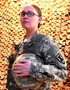 U.S. Army Staff Sgt. Cassandra Partee, 53rd Movement Control Battalion Headquarters command team administrator, has fought on the front lines in her two deployments to Iraq. Partee said it was no surprise to her when, in one of his final decisions as Secretary of Defense, Leon Panetta announced the lifting of rules excluding women from some combat roles. (U.S. Army photo by Sgt. Edwin Rodriguez/Released).
