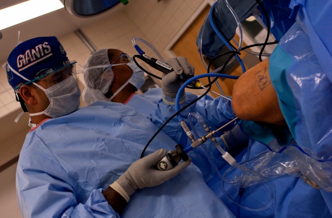 U.S. Army Dr. (Maj.) Rasel Rana, McDonald Army Health Center chief of orthopedic surgery, inserts a surgical tool into the patient’s knee during a procedure in the MCAHC operating room at Fort Eustis, Va., March 13, 2013. According to the American Academy of Orthopedic Surgeons, one in seven Americans suffer from an orthopedic impairment, making orthopedic complaints the top reason patients seek medical care. (U.S. Air Force photo by Airman 1st Class R. Alex Durbin/Released)