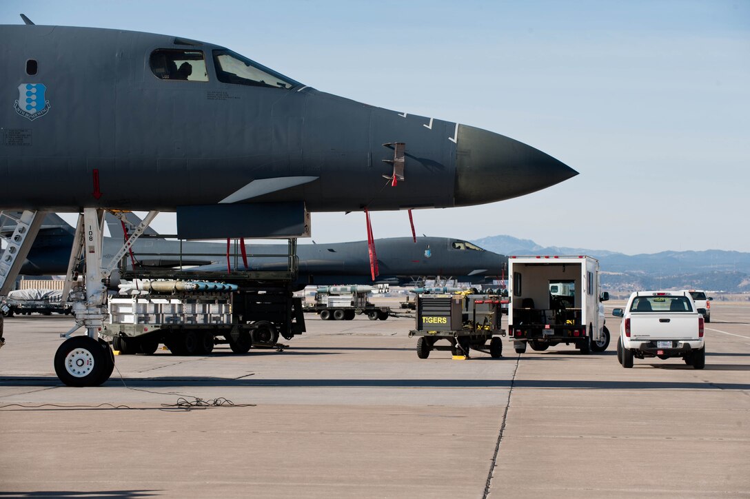 B-1 bombers are loaded with munitions during an Operational Readiness Exercise at Ellsworth Air Force Base, S.D., March 20, 2013. The ORE covered a wide range of operations and was designed to test Airmen’s ability to deploy personnel, aircraft and equipment. (U.S. Air Force photo by Airman 1st Class Zachary Hada/Released)