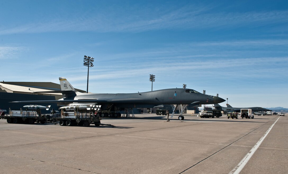Load crew members assigned to the 28th Aircraft Maintenance Squadron, load munitions into a B-1 bomber during an Operational Readiness Exercise at Ellsworth Air Force Base, S.D., March 20, 2013. The weapons section manages the weapons loading and support activities to ensure the B-1 bomber fleet are mission ready. (U.S. Air Force photo by Airman 1st Class Zachary Hada/Released)
