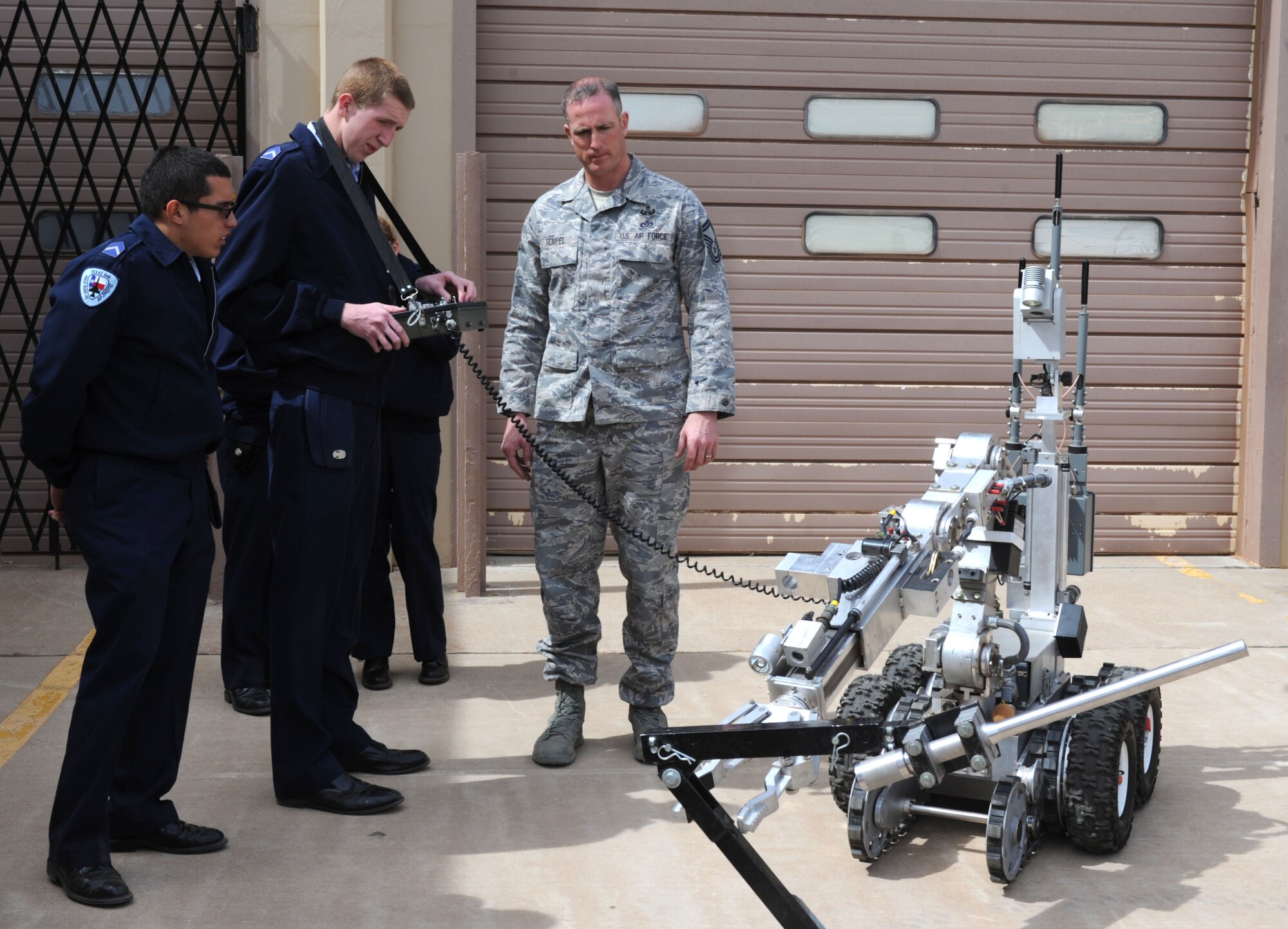 Members of the Amarillo division Junior Reserve Officer Training Corps operate an explosive ordnance device machine during a tour of Cannon Air Force Base, N.M., March, 20, 2013. Air Force JROTC is the high school variation of the college ROTC program where students can experience military training while achieving their high school education. (U.S. Air Force photo/Airman 1st Class Ericka Engblom)