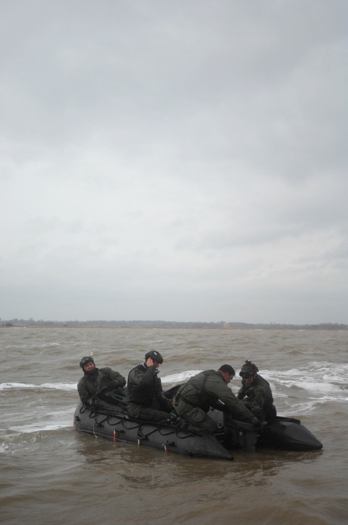 Airmen from the 321st Special Tactics Squadron set up an inflatable motor raft during a water-landing exercise March 15, 2013, off the coast of Ipswich, England. Airmen had to jump form a C-130, land in the water, and inflate a raft during the exercise. (U.S. Air Force photo by Airman 1st Class Dillon Johnston/Released)