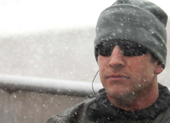 Staff Sgt. Seth Barta, 321st Special Tactics Squardon pararescueman, rides on a boat heading to a drop zone for a water-landing exercise March 15, 2013, off the coast of Ipswich, England. Barta acted as a medical service provider in case anyone was injured during the exercise. (U.S. Air Force photo by Airman 1st Class Dillon Johnston/Released)