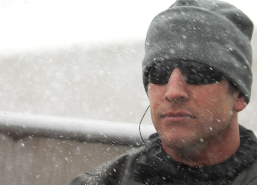 Staff Sgt. Seth Barta, 321st Special Tactics Squardon pararescueman, rides on a boat heading to a drop zone for a water-landing exercise March 15, 2013, off the coast of Ipswich, England. Barta acted as a medical service provider in case anyone was injured during the exercise. (U.S. Air Force photo by Airman 1st Class Dillon Johnston/Released)