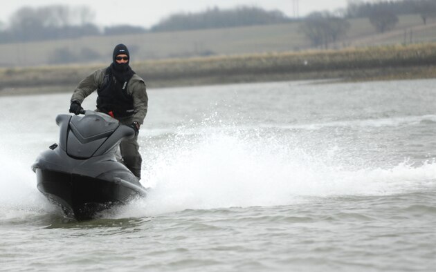Maj. Travis Woodworth, 321st Special Tactics Squadron commander, rides a jet-ski to a drop zone for a water-landing exercise March 15, 2013, off the coast of Ipswich, England. The 321st STS conducted a week-long jump exercise to keep its members proficient in their ability to tactically insert into combat zones. (U.S. Air Force photo by Airman 1st Class Dillon Johnston/Released)