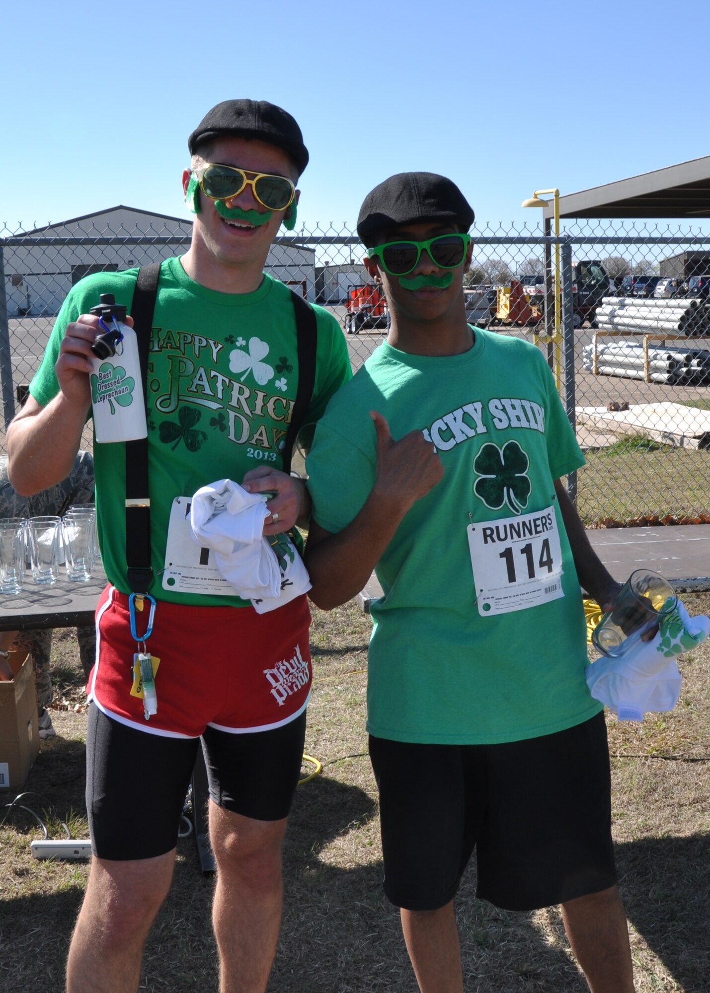 GOODFELLOW AIR FORCE BASE, Texas – Airman 1st Class John Moore, 17th Comptroller Squadron special actions technician, poses for a picture after receiving the award for most creative leprechaun at the St. Patrick’s Day Run on the Kiowa Trail here March 15. Airman 1st Class Michael Ware, 17th Comptroller Squadron customer service technician, received the runner up award. (U.S. Air Force photo/ Airman 1st Class Joshua Edwards)