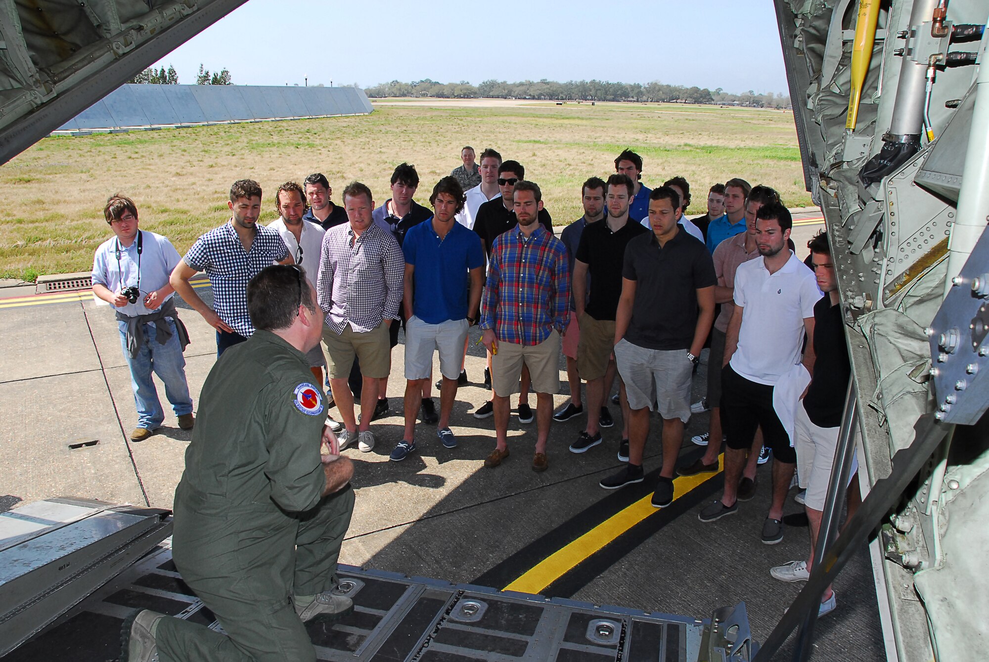 MSgt Jeff Stack, a 53rd Weather Reconnaissance Squadron loadmaster, describes his duties to the Mississippi Surge Hockey team on March 18, 2013.  The team visited the 403rd Wing to see a WC-130J, the aircraft maintenance shop and the propulsion shop.  (U.S. Air Force photo by Tech. Sgt. Jessica Kendziorek)