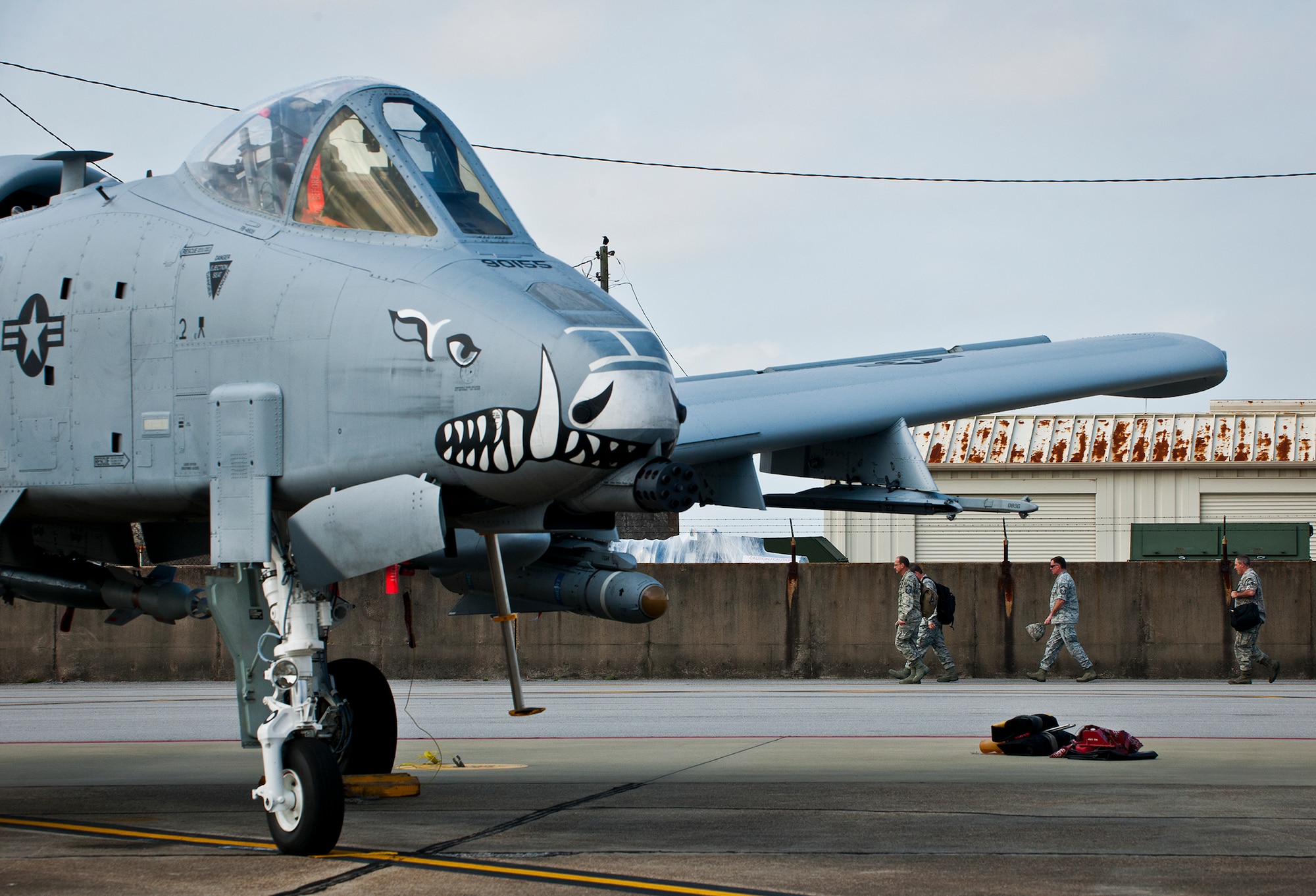 A-10 Thunderbolt II maintainers with the 442nd Fighter Wing walk in to work at Eglin Air Force Base, Fla., March 19.  The 442nd A-10s traveled from Whiteman AFB for the week-long, air-to-ground weapons system evaluation program called Combat Hammer.  Combat Hammer, run by the 86th Fighter Weapons Squadron, is used to evaluate the effectiveness and suitability of combat air force weapon systems. The air-to-air and air-to-ground WSEP evaluations are accomplished during tactical deliveries of fighter, bomber and unmanned aircraft system precision guided munitions, on realistic targets with air-to-air and surface-to-air defenses. (U.S. Air Force photo/Samuel King Jr.)
