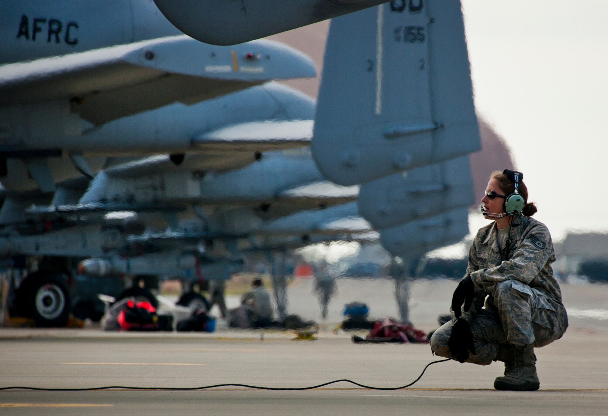 Staff Sgt. Jessica Womrath, a crew chief with the 442nd Fighter Wing, performs preflight checks on an A-10 Thunderbolt II prior to a sortie at Eglin Air Force Base, Fla., March 19.  The 442nd A-10s traveled from Whiteman AFB for the week-long, air-to-ground weapons system evaluation program called Combat Hammer.  Combat Hammer, run by the 86th Fighter Weapons Squadron, is used to evaluate the effectiveness and suitability of combat air force weapon systems. The air-to-air and air-to-ground WSEP evaluations are accomplished during tactical deliveries of fighter, bomber and unmanned aircraft system precision guided munitions, on realistic targets with air-to-air and surface-to-air defenses. (U.S. Air Force photo/Samuel King Jr.)