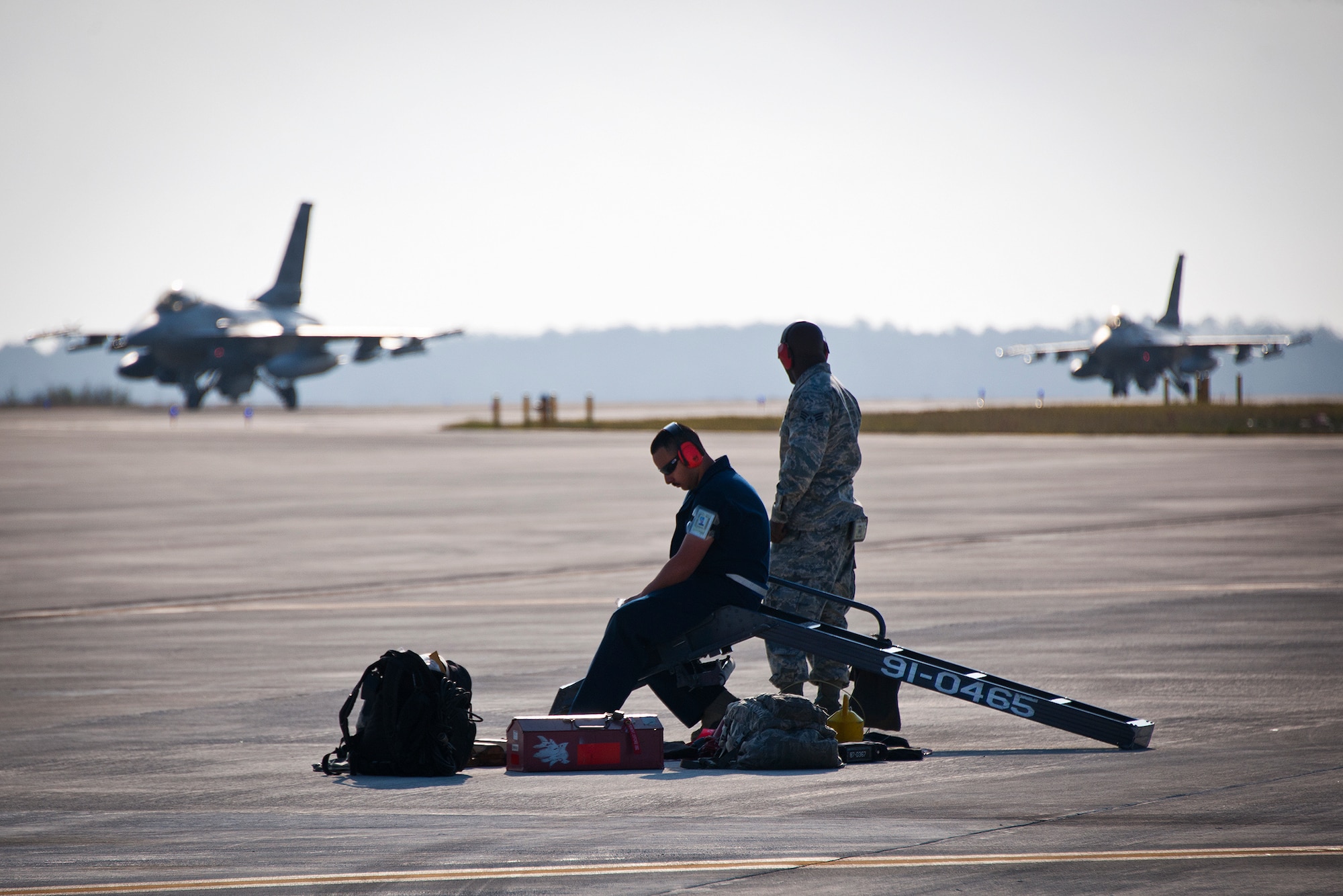 Maintainers with the 482nd Fighter Wing watch as their F-16 Fighting Falcons roll by at Eglin Air Force Base, Fla., March 18.  The 482nd F-16s traveled from Homestead ARB for the week-long, air-to-ground weapons system evaluation program called Combat Hammer.  Combat Hammer, run by the 86th Fighter Weapons Squadron, is used to evaluate the effectiveness and suitability of combat air force weapon systems. The air-to-air and air-to-ground WSEP evaluations are accomplished during tactical deliveries of fighter, bomber and unmanned aircraft system precision guided munitions, on realistic targets with air-to-air and surface-to-air defenses. (U.S. Air Force photo/Samuel King Jr.)