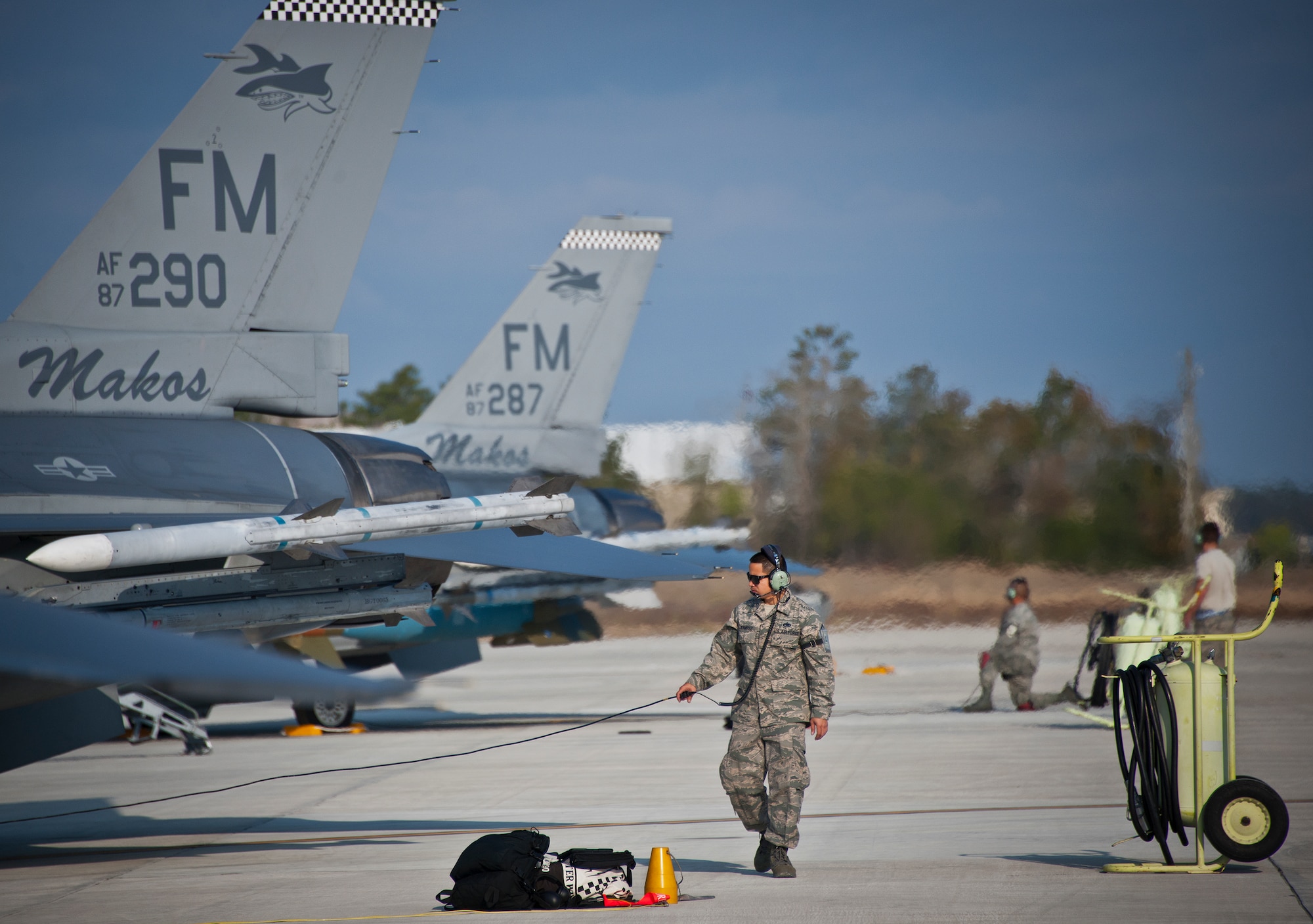 Master Sgt. Thomas Ramirez, a maintainer with the 482nd Fighter Wing, performs preflight checks on an F-16 Fighting Falcon prior to a sortie at Eglin Air Force Base, Fla., March 18.  The 482nd F-16s traveled from Homestead ARB for the week-long, air-to-ground weapons system evaluation program called Combat Hammer.  Combat Hammer, run by the 86th Fighter Weapons Squadron, is used to evaluate the effectiveness and suitability of combat air force weapon systems. The air-to-air and air-to-ground WSEP evaluations are accomplished during tactical deliveries of fighter, bomber and unmanned aircraft system precision guided munitions, on realistic targets with air-to-air and surface-to-air defenses.  (U.S. Air Force photo/Samuel King Jr.)