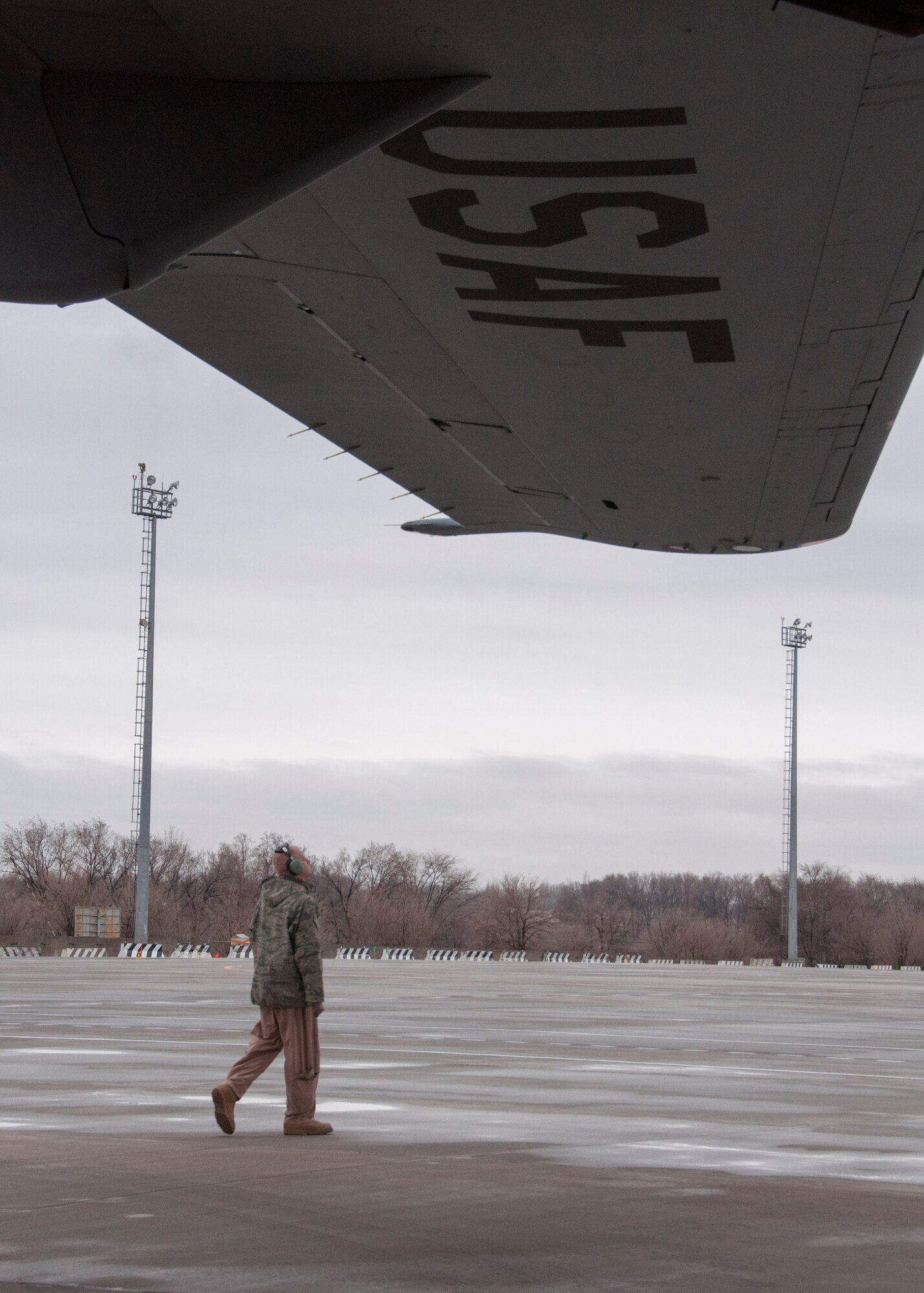 Capt. Daniel Hewes, 817th Expeditionary Airlift Squadron Detachment 1 aircraft commander, conducts a pre-flight walk-around inspection of a C-17 Globemaster III aircraft March 22, 2013, at Transit Center at Manas, Kyrgyzstan. The C-17 measures 174 feet long with a wingspan of 169 feet, 10 inches. (U.S. Air Force photo/Tech. Sgt. Rachel Martinez)