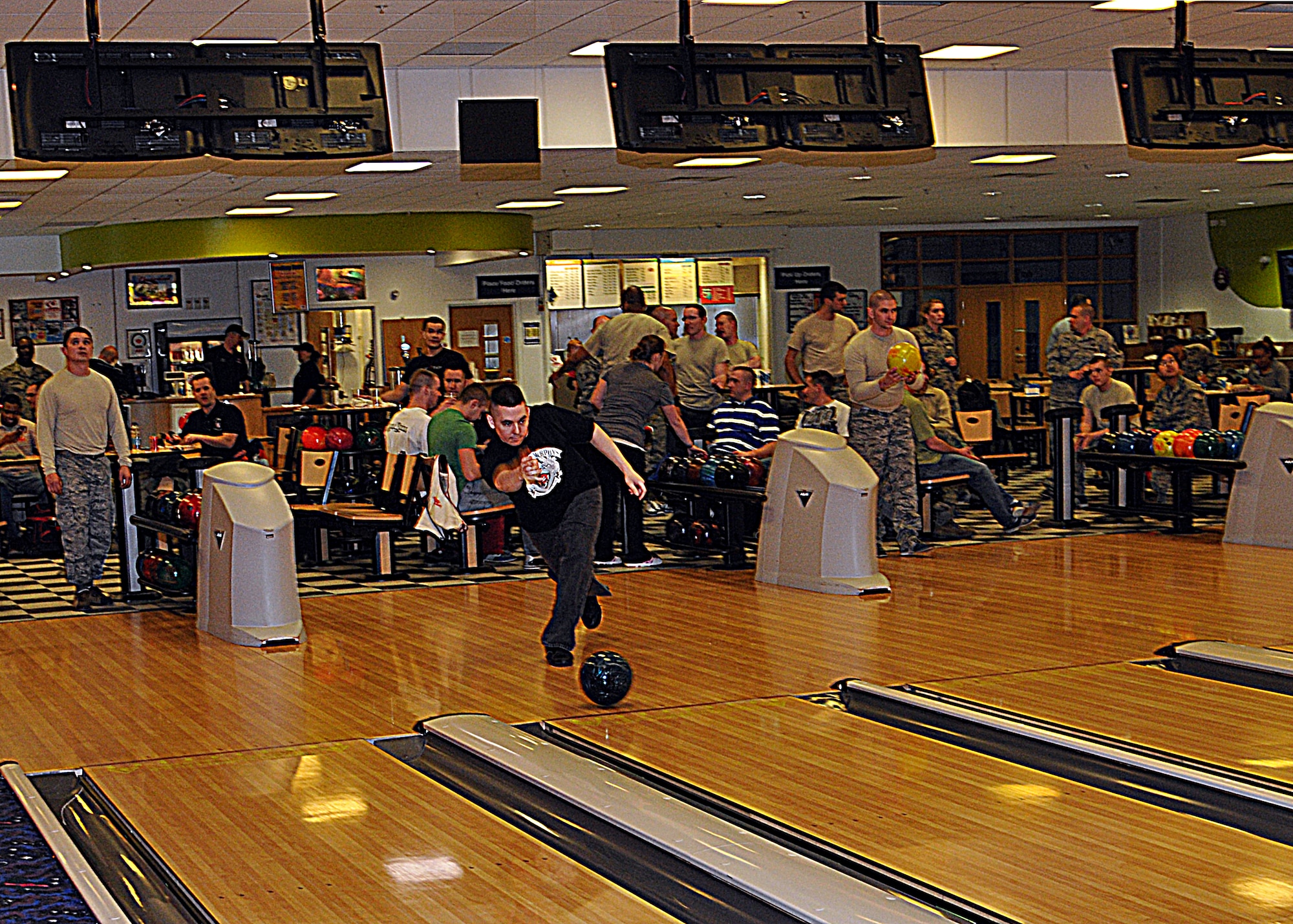 Airmen participate in the RAF Mildenhall First Sergeant’s Bowl-a-Thon March 22, 2013, at the bowling alley on RAF Mildenhall, England.  The Bowl-a-Thon received base-wide support as Airmen knocked down pins for the First Sergeants Council. The hours of operation for the bowling alley are: Monday- Thursday 10:30 a.m. – 9 p.m., Friday and Saturday 10:30 a.m. – 11 p.m., and Sundays 10:30 a.m. - 9p.m. (U.S. Air Force photo by Airman 1st Class Kelsey Waters)