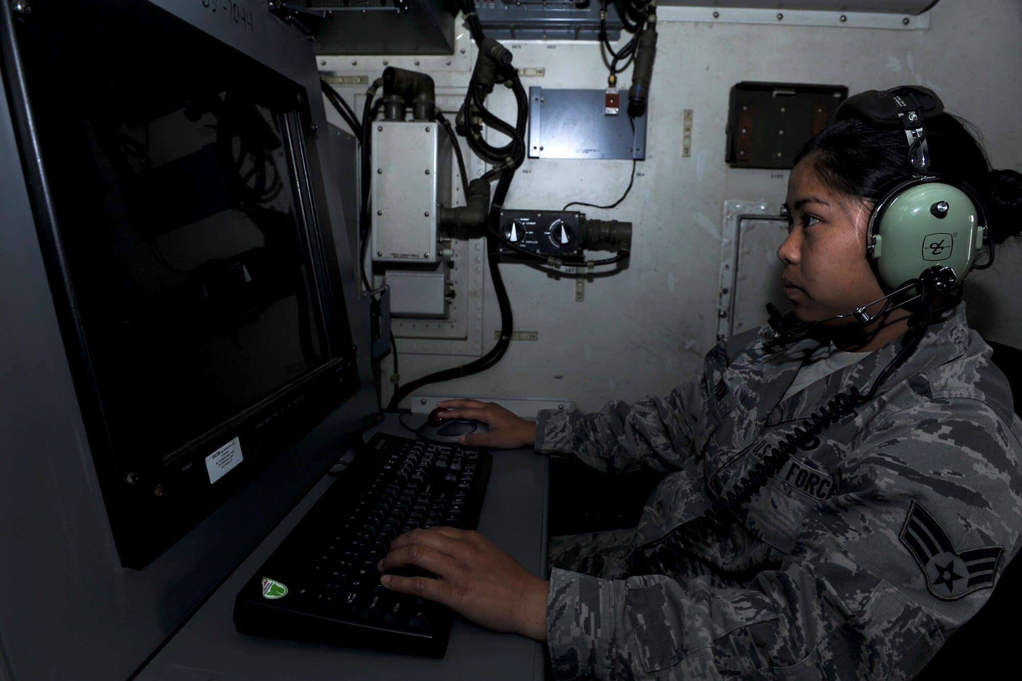 U.S. Air Force Senior Airman Thuy Nguyen, 623rd Air Control Flight weapons director technician, checks a radar during a training exercise on Kadena Air Base, Japan, March 21, 2013. Nguyen recently won the Pacific Air Forces Command and Control Battle Management Operator of the Year Award for 2012. (U.S. Air Force photo/Airman 1st Class Justin Veazie)