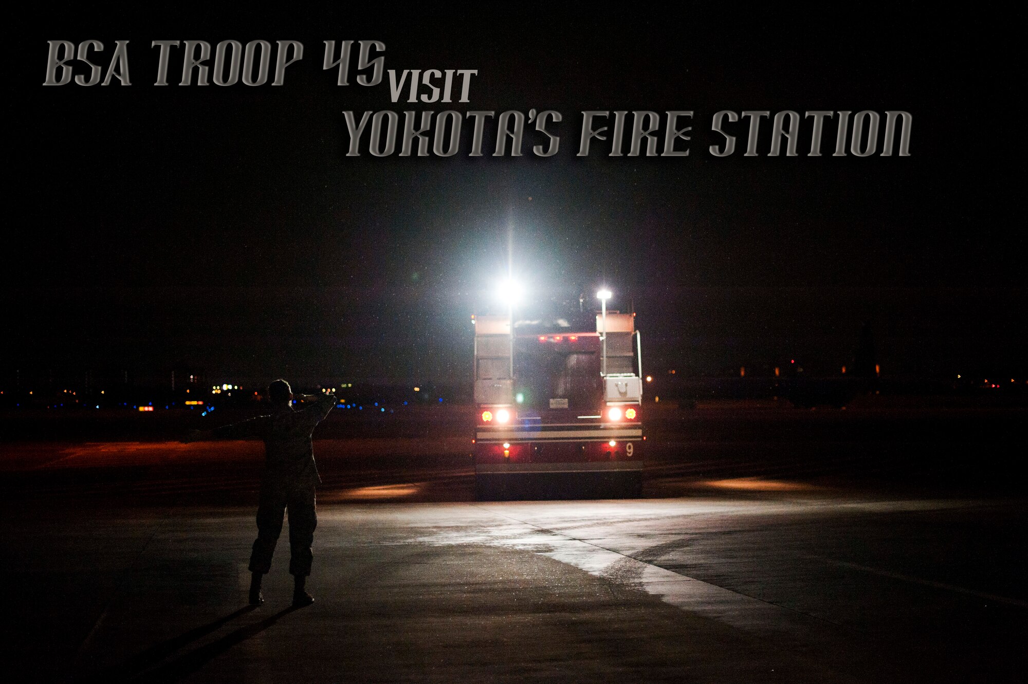 YOKOTA AIR BASE, Japan -- A fire truck backs up after a demonstration, March 20, 2013, at Yokota Air Base, Japan.  Every Airman in the 374th Civil Engineer Squadron Fire Protection must learn how to drive the trucks to respond to any emergency. (U.S. Air Force graphic by Airman 1st Class Meagan Schutter)