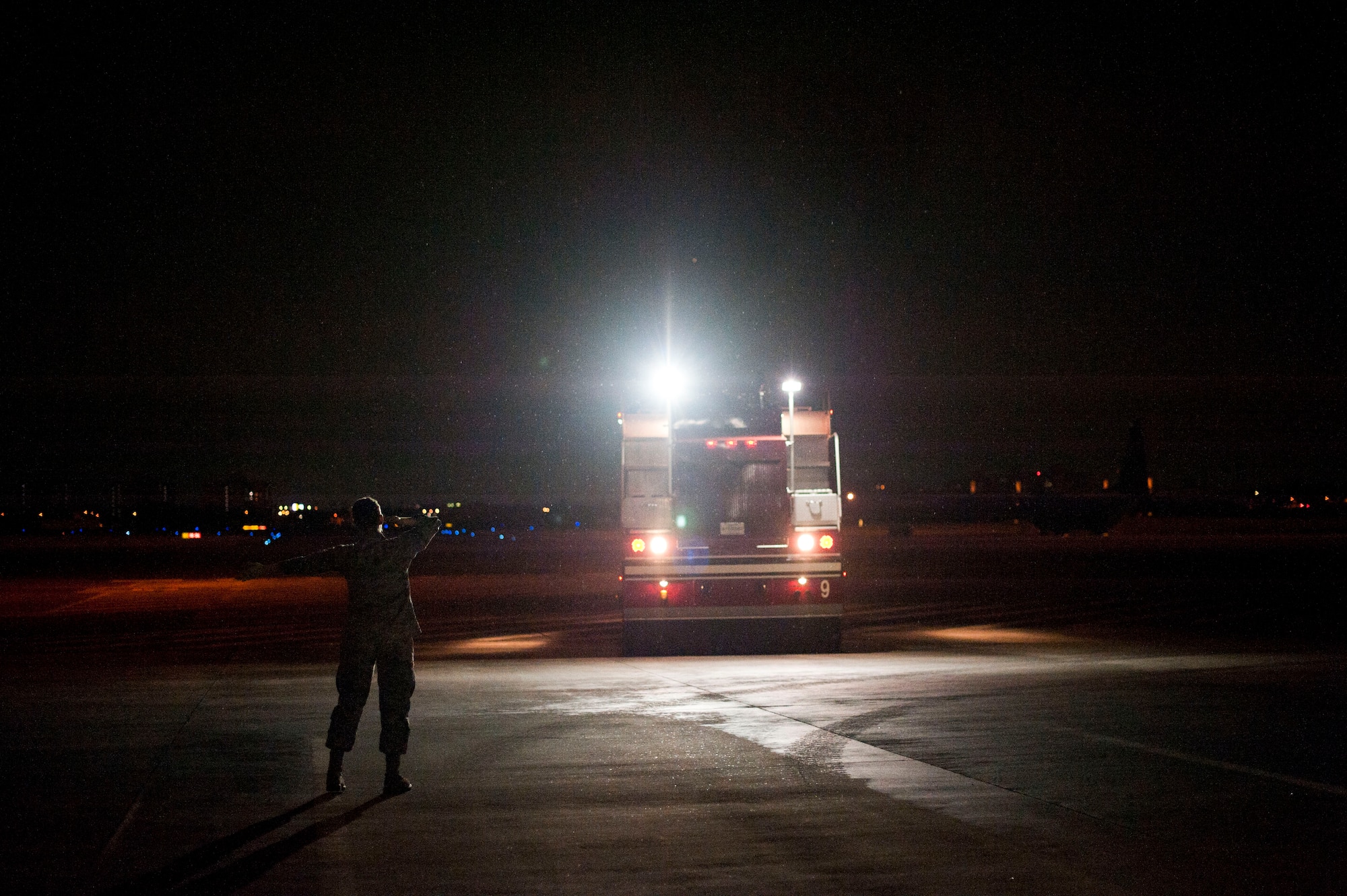 YOKOTA AIR BASE, Japan -- A fire truck backs up after a demonstration, March 20, 2013, at Yokota Air Base, Japan.  Every Airman in the 374th Civil Engineer Squadron Fire Protection must learn how to drive the trucks to respond to any emergency. (U.S. Air Force photo by Airman 1st Class Meagan Schutter)