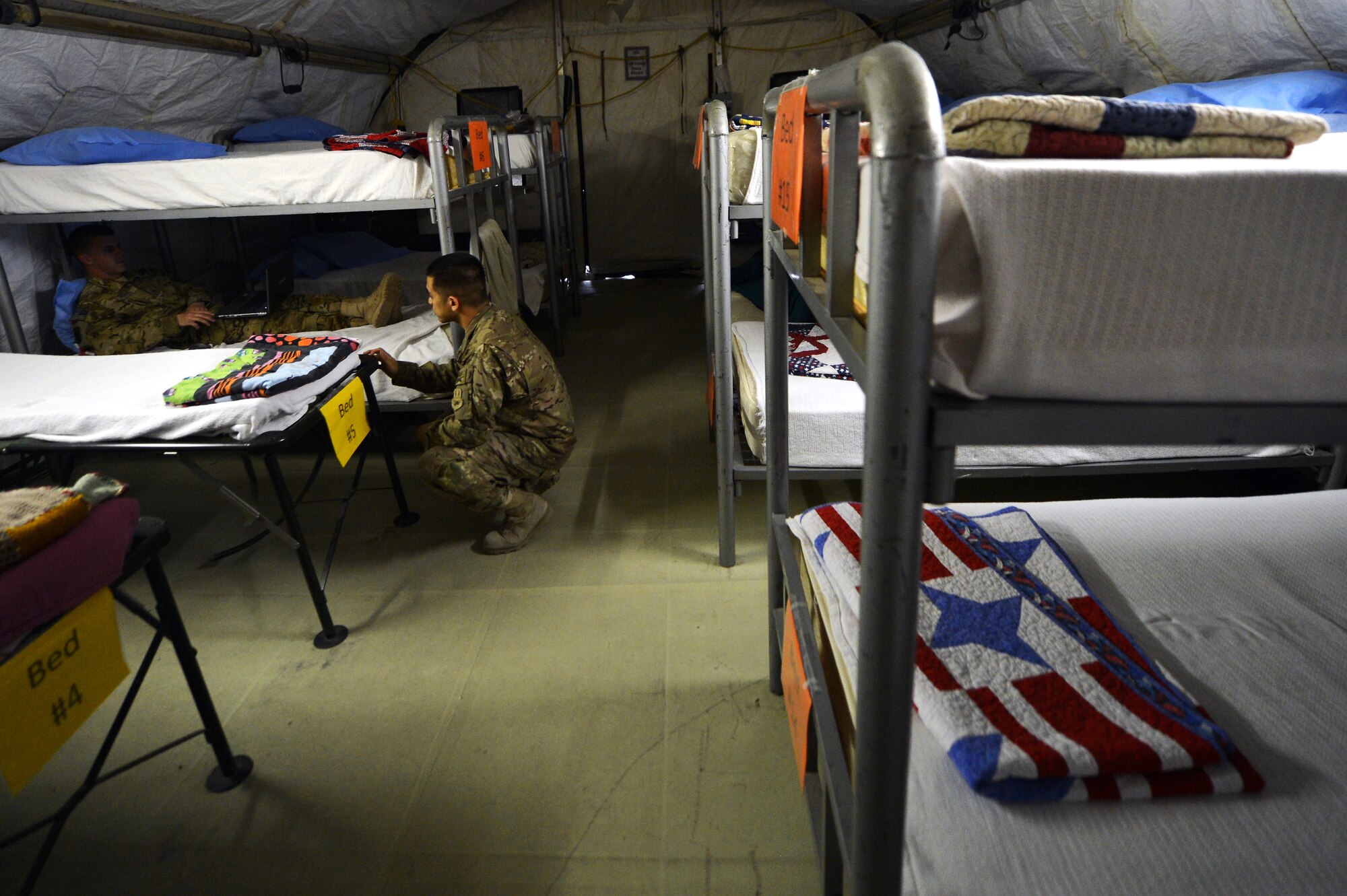 Contingency Aeromedical Staging Facility personnel take care of patients on Bagram Airfield, Afghanistan, March 8, 2013. The CASF caters to both inbound and outbound patients brought in by the 455th Expeditionary Aeromedical Evacuation Squadron enroute to Landstuhl Regional Medical Center, Germany, for a higher level of medical attention. (U.S. Air Force photo/Senior Airman Chris Willis)