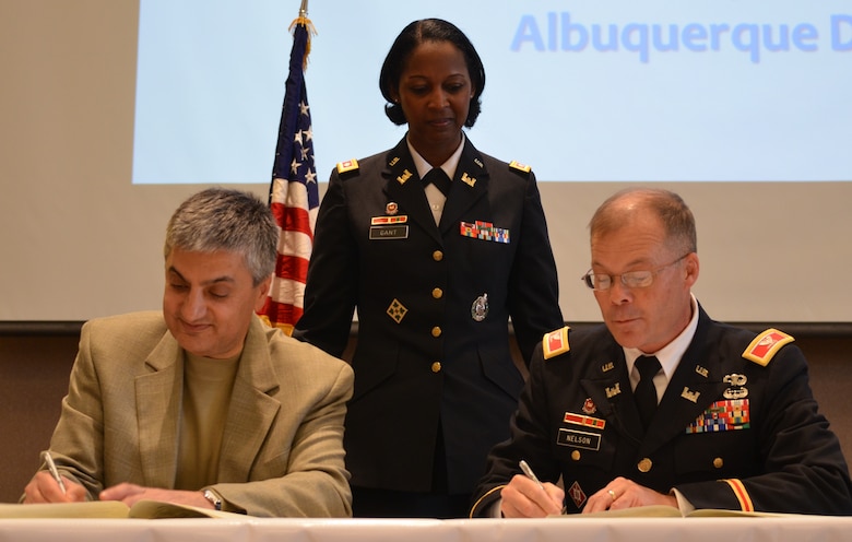 ALBUQUERQUE, N.M., -- Mr.Chaouki Abdallah, provost, University of New Mexico (left); Lt. Col. Antoinette Gant, commander, Albuquerque District, and Col. Andrew Nelson, deputy commander, South Pacific Division, participate in the Memorandum of Agreement Signing Ceremony. The District and UNM will work together to promote and encourage the study of STEM fields: Science, Technology, Engineers and Math. 