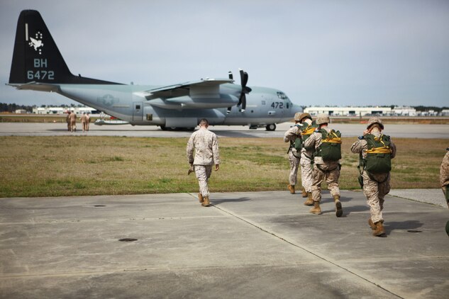 Marines from Landing Support Company, Combat Logistics Regiment 27, 2nd Marine Logistics Group  walk toward a C-130 Hercules March 20, 2013 aboard Marine Corps Air Station New River, N.C., to conduct an airborne exercise. This jump was used to renew airborne certifications. 