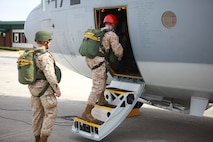 Marines from Landing Support Company, Combat Logistics Regiment 27, 2nd Marine Logistics Group board a C-130 Hercules aboard Marine Corps Air Station New River, N.C.,  for an airborne exercise March 20, 2013. Marines who are airborne certified must jump at least once per quarter. 