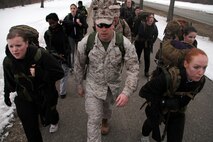 Recruiting Substation Buffalo's Staff Sgt. Steven McColl leads a group of aspiring Lady Leathernecks on a five-mile morning hike March 23 to prepare them for boot camp. Many of the hike participants are currently in Recruiting Station Twin Cities' Delayed Entry Program and will ship to boot camp later this year. For additional imagery from the event, visit www.facebook.com/rstwincities.   