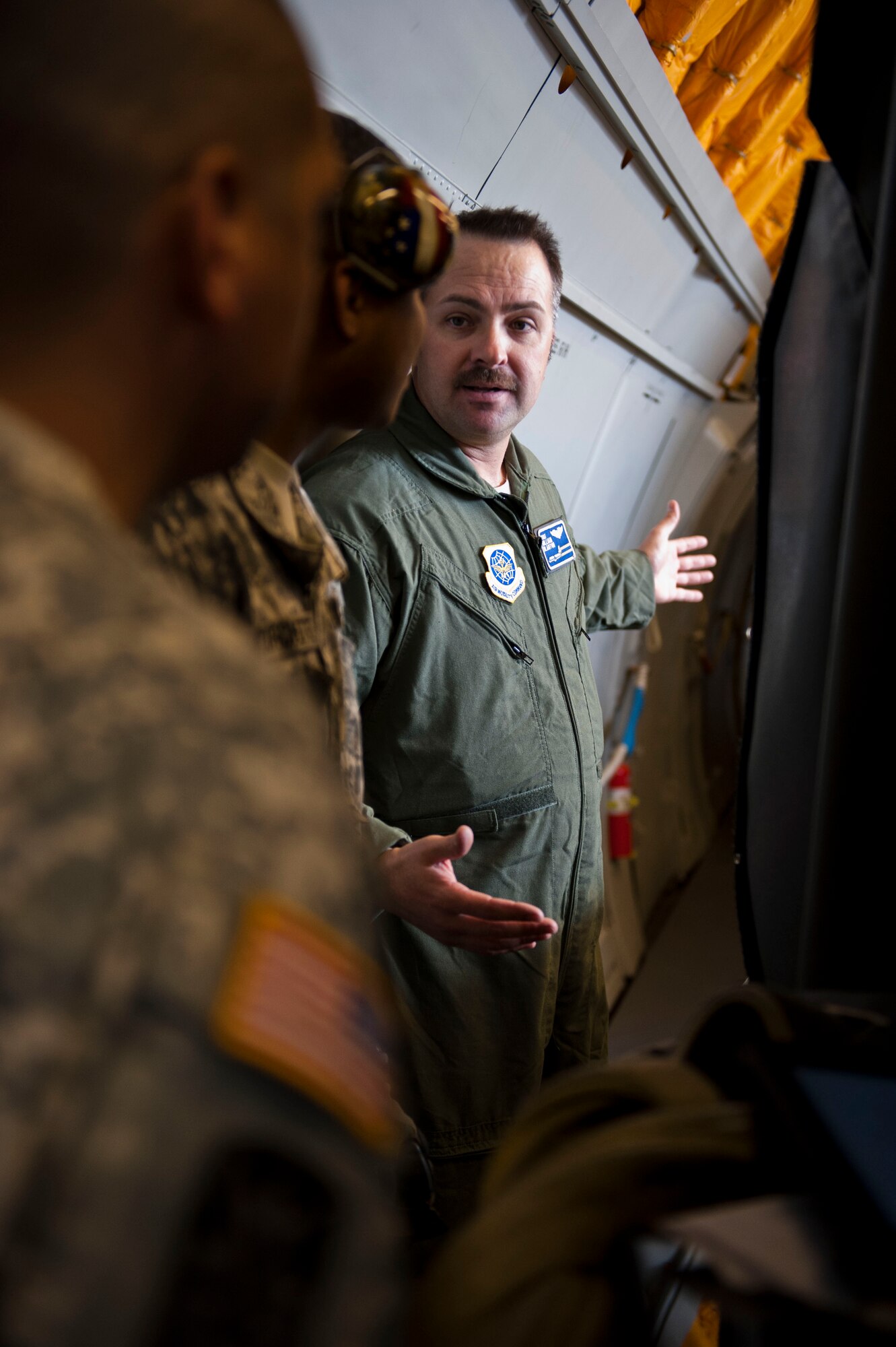 YOKOTA AIR BASE, Japan – Tech. Sgt. William Blanton informs Army members about base operations and the aircraft his unit uses to ensure the mission is completed at Yokota Air Base, Japan, March 20, 2013. Members of the 623rd Movement Control Team deal with the loading and unloading of cargo everyday in their career field, and their visit to Yokota allowed them to familiarize themselves with possible Air Force assets they will encounter while moving cargo in a deployed location. (U.S. Air Force photo by Airman 1st Class Meagan Schutter)