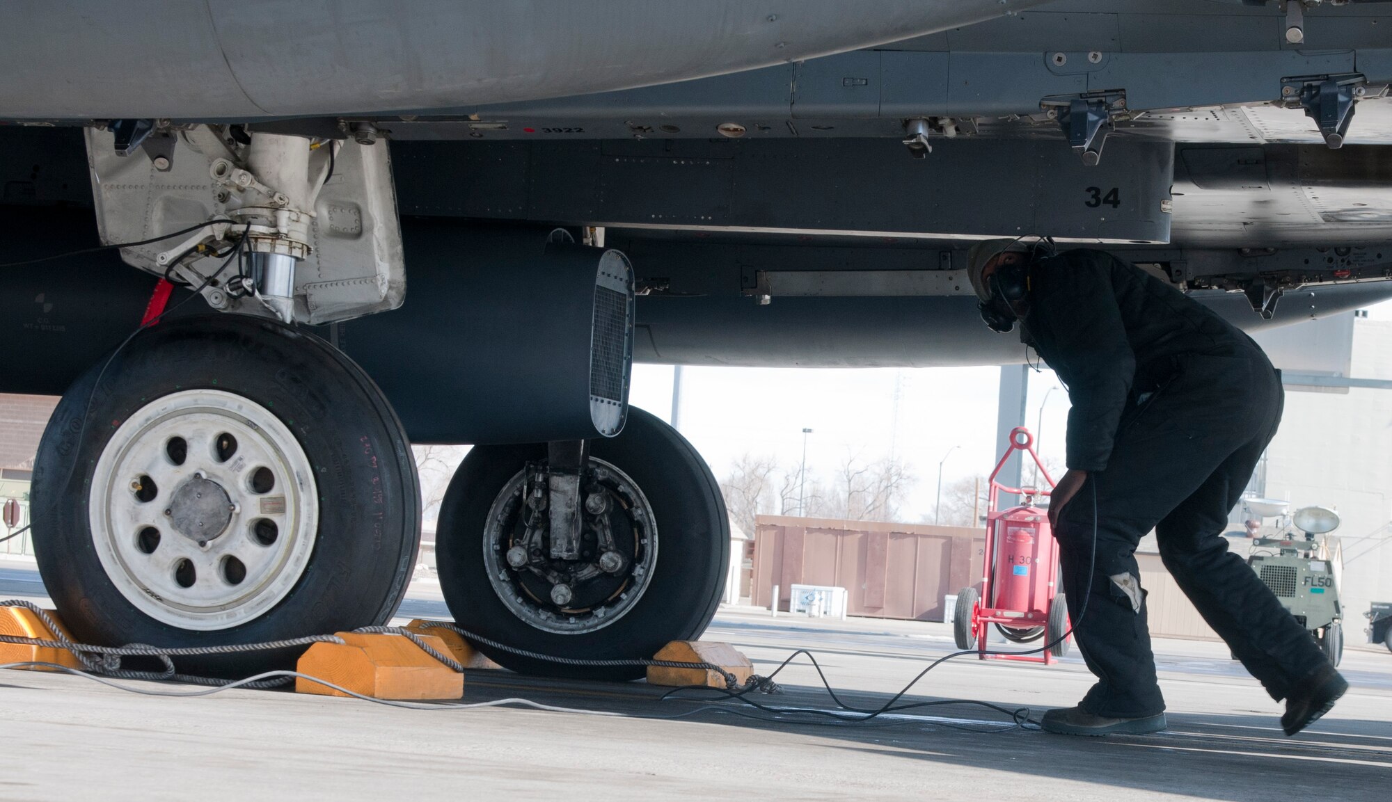 U.S. Air Force Airman 1st Class Emmanuel Osagiede, 389th Aircraft Maintenance Unit crew chief, completes a pre-flight check, Feb. 28, 2013, at Mountain Home Air Force Base, Idaho. Before each departure, jets undergo a thorough safety inspection to ensure the aircrew is safe during flight. (U.S. Air Force photo/Senior Airman Heather Hayward)