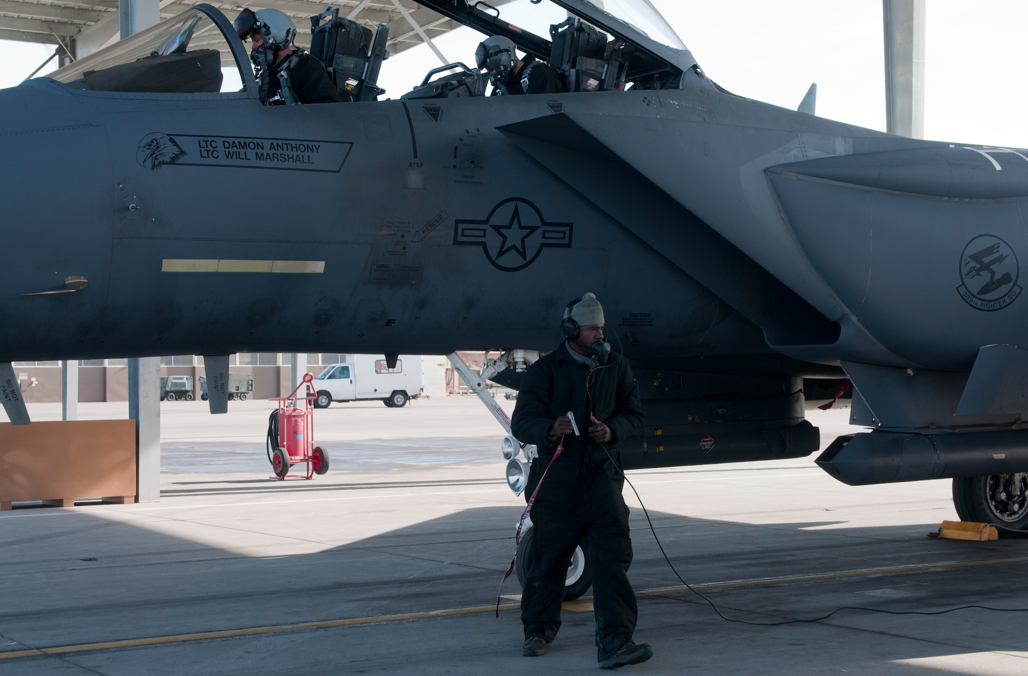 U.S. Air Force Airman 1st Class Emmanuel Osagiede, 389th Aircraft Maintenance Unit crew chief, carries a pin that was removed during a pre-flight check, Feb. 28, 2013, at Mountain Home Air Force Base, Idaho. Trust between the air and maintenance crews is crucial to mission success. (U.S. Air Force photo/Senior Airman Heather Hayward)