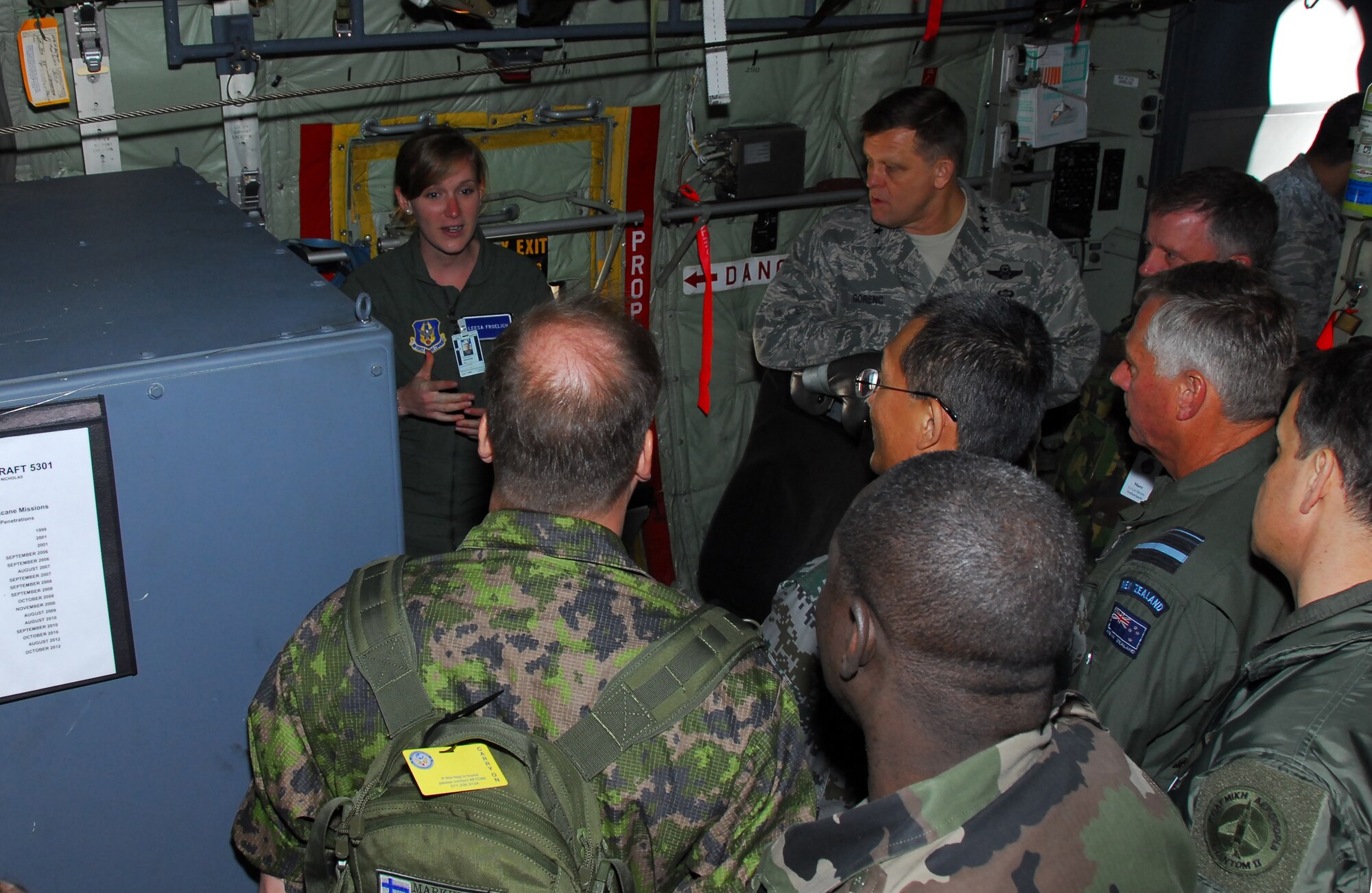 Lt. Leesa Froelich, 53rd Weather Reconnaissance weather officer, explains the weather equipment to the visiting members of the air attache during a static tour of a WC-130J here on March 26, 2013.  The group traveled from Washington, D.C. to visit a selection of active duty and reserve facilities on Keesler Air Force Base (U.S. Air Force Photo by Tech. Sgt. Jessica L. Kendziorek).