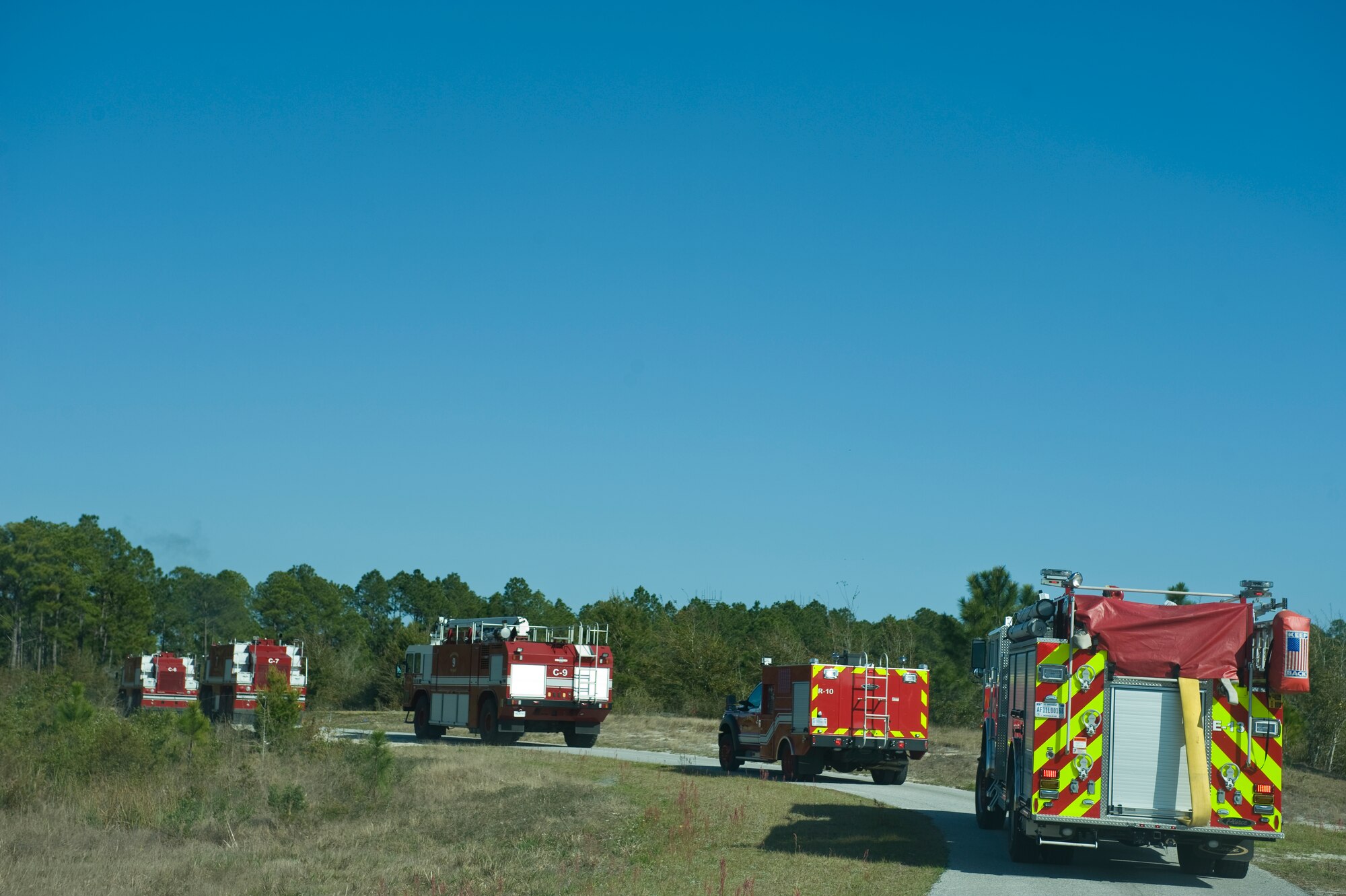 Firefighters of the 1st Special Operations Civil Engineer Squadron and Hurlburt Field leadership participate in an aircraft crash exercise at the Fire Training Pit at Hulrburt Field, Fla., March 19, 2013. The exercise gave senior leadership insight into Hurlburt Field’s tactical response to aircraft crashes. (U.S. Air Force Photo/Airman 1st Class Hayden K. Hyatt) 