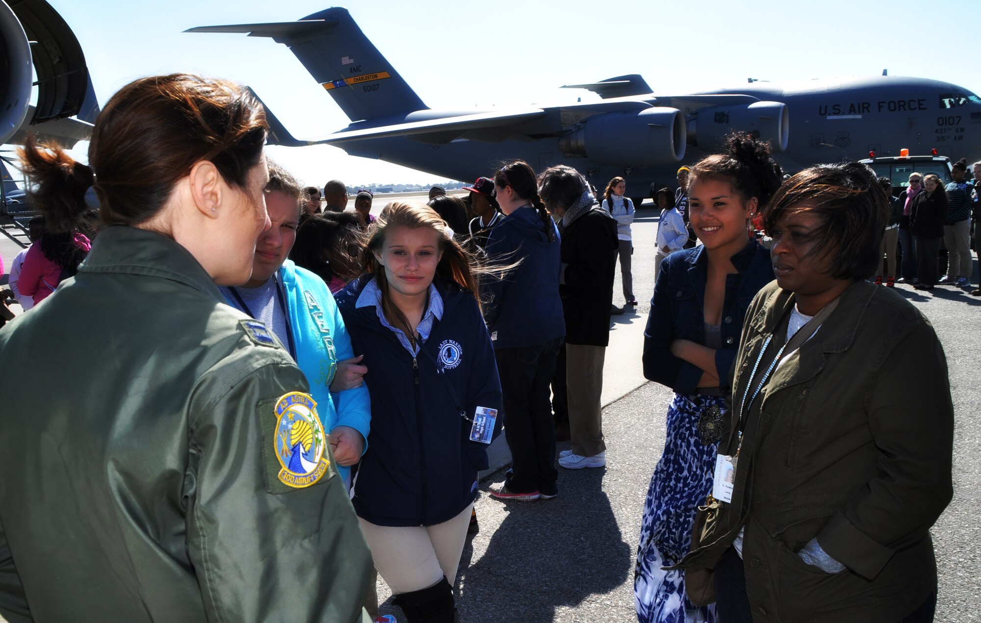 Capt. Molly Sanford, 315th Airlift Wing pilot, talks to girls on the flight line just before a tour of the C-17 Globemaster III aircraft at Joint Base Charleston, SC, March 26. Nearly 140 eighth and ninth grade-girls from Charleston area schools visited to learn about jobs in aviation. (U.S. Air Force photo/Tech. Sgt. Scott Mathews)
