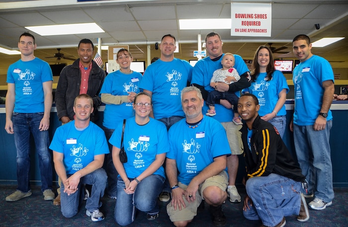 Airmen, civilians and dependents from Joint Base Charleston pose for a photo March 22, 2013, during a Special Olympics South Carolina Area 6 Bowling Event  in West Ashley, S.C. Thirty five students from Zucker Middle School, Morningside Middle School, Fort Johnson Middle School and St. Andrews Middle School participated in the event. (Courtesy photo)