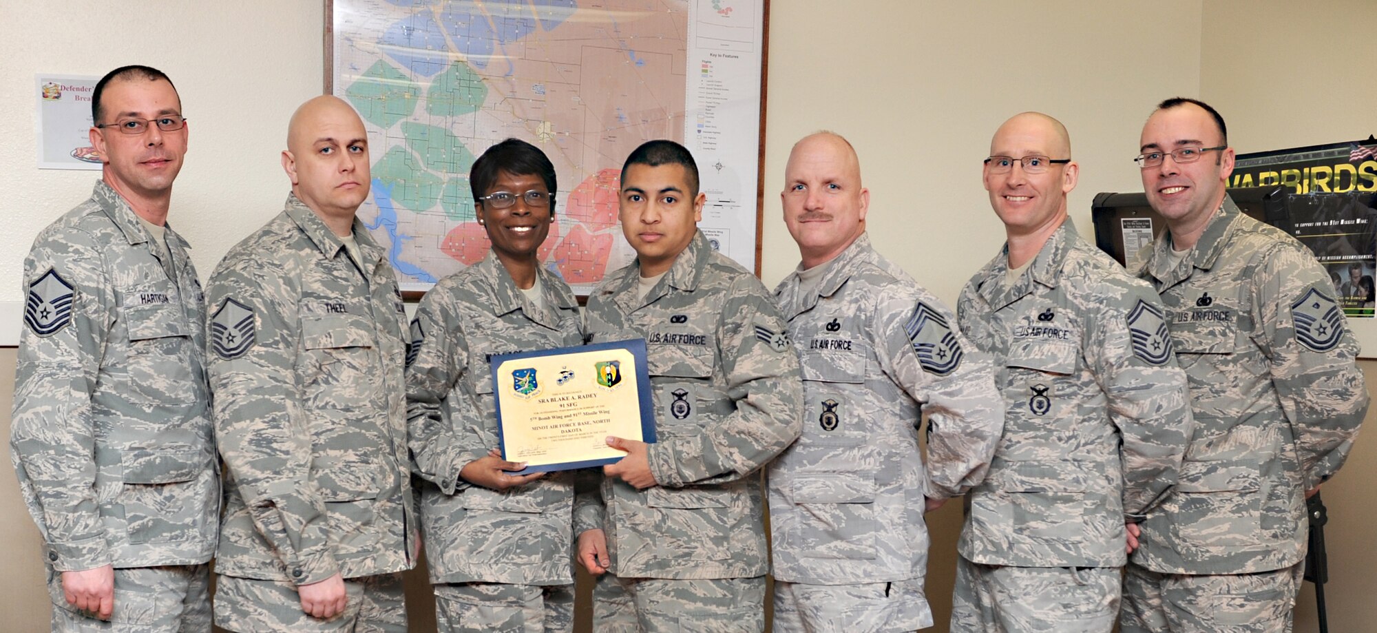 MINOT AIR FORCE BASE, N.D. -- The Minot Top 3 awarded Senior Airman Blake A. Radey, 791st Missile Security Forces Squadron response force leader, with the Top 3 Award, March 21. Airman Radey led 688 hours of Mobile Fire Team security for four penetrated sites, thirteen open launchers, and four nuclear convoys in direct support of maintenance operations. His leadership was instrumental to the 91 MW maintaining a 99% ICBM alert rate. Additionally, Airman Radey’s superior military bearing and excellent public speaking abilities resulted in his selection to conduct the unit’s mission brief for the CUI IG inspectors.  Moreover, he was hand-selected to assist the Convoys Flight during Lt. Gen. Judith A. Fedder’s visit where he showcased MFT capabilities and tactics. For this and much more, Airman Radey has proved he is a true asset to the City of Minot, his squadron, Minot Air Force Base and the Air Force. (U.S. Air Force photo/Airman 1st Class Stephanie Ashley)