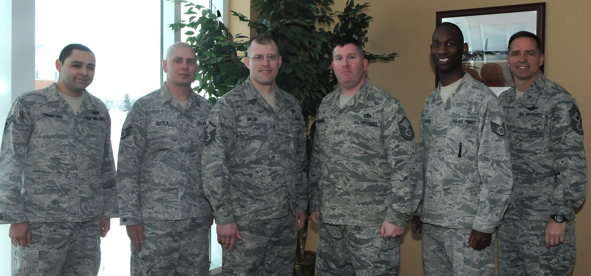 MINOT AIR FORCE BASE, N.D. -- Centralized Dormitory Management provides direct residential infrastructure support to 1,200 Airmen for 5th Bomb Wing and 91st Missile Wing in 16 dormitories valued at $150 million. The CDM staff is responsible for the in and out-processing of newly assigned Airmen. They brief them on Air Force, Command, and Local dormitory policies, regulations, and corrective actions. They are also responsible for training dormitory resident advisors on how to monitor dormitories, resolve any conflicts and ensure residents' safety. Finally, the CDM Team manages Team Minot's Bay Orderly Program by coordinating with 27 First Sergeants to maintain the upkeep and cleanliness of 1,495 dorm rooms. (Photo Courtesy of the Command Chief's Office)