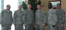 MINOT AIR FORCE BASE, N.D. -- Centralized Dormitory Management provides direct residential infrastructure support to 1,200 Airmen for 5th Bomb Wing and 91st Missile Wing in 16 dormitories valued at $150 million. The CDM staff is responsible for the in and out-processing of newly assigned Airmen. They brief them on Air Force, Command, and Local dormitory policies, regulations, and corrective actions. They are also responsible for training dormitory resident advisors on how to monitor dormitories, resolve any conflicts and ensure residents' safety. Finally, the CDM Team manages Team Minot's Bay Orderly Program by coordinating with 27 First Sergeants to maintain the upkeep and cleanliness of 1,495 dorm rooms. (Photo Courtesy of the Command Chief's Office)