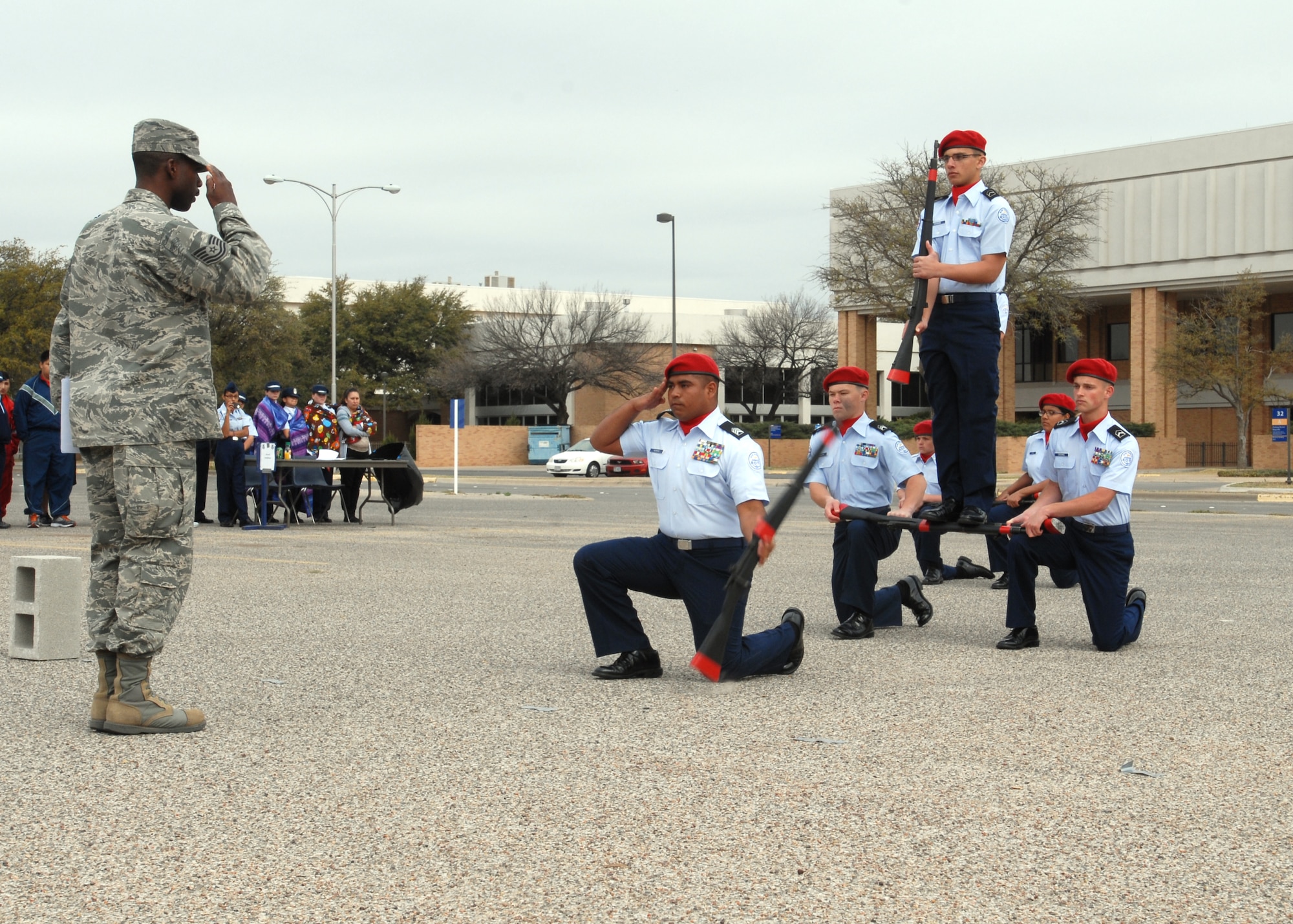 SAN ANGELO, Texas – Tech. Sgt. Kyle Leak, 315th Training Squadron military training instructor, salutes members of the Cleveland High School Air Force Junior ROTC during the Angelo State University’s Junior ROTC Drill Meet, March 23. The drill meet featured 13 different competition events. (U.S. Air Force photo/ Airman 1st Class Joshua Edwards)