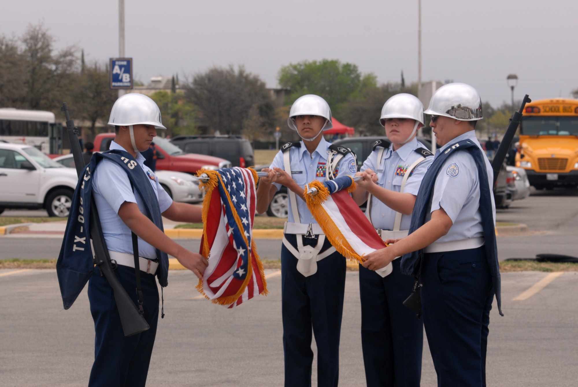 SAN ANGELO, Texas – The Del Rio High School Air Force Junior ROTC male color guard roll up the U.S. and Texas flags at the Angelo State University’s Junior ROTC Drill Meet, March 23. Del Rio, along with eight other high schools, competed at the drill meet. (U.S. Air Force photo/ Airman 1st Class Joshua Edwards)