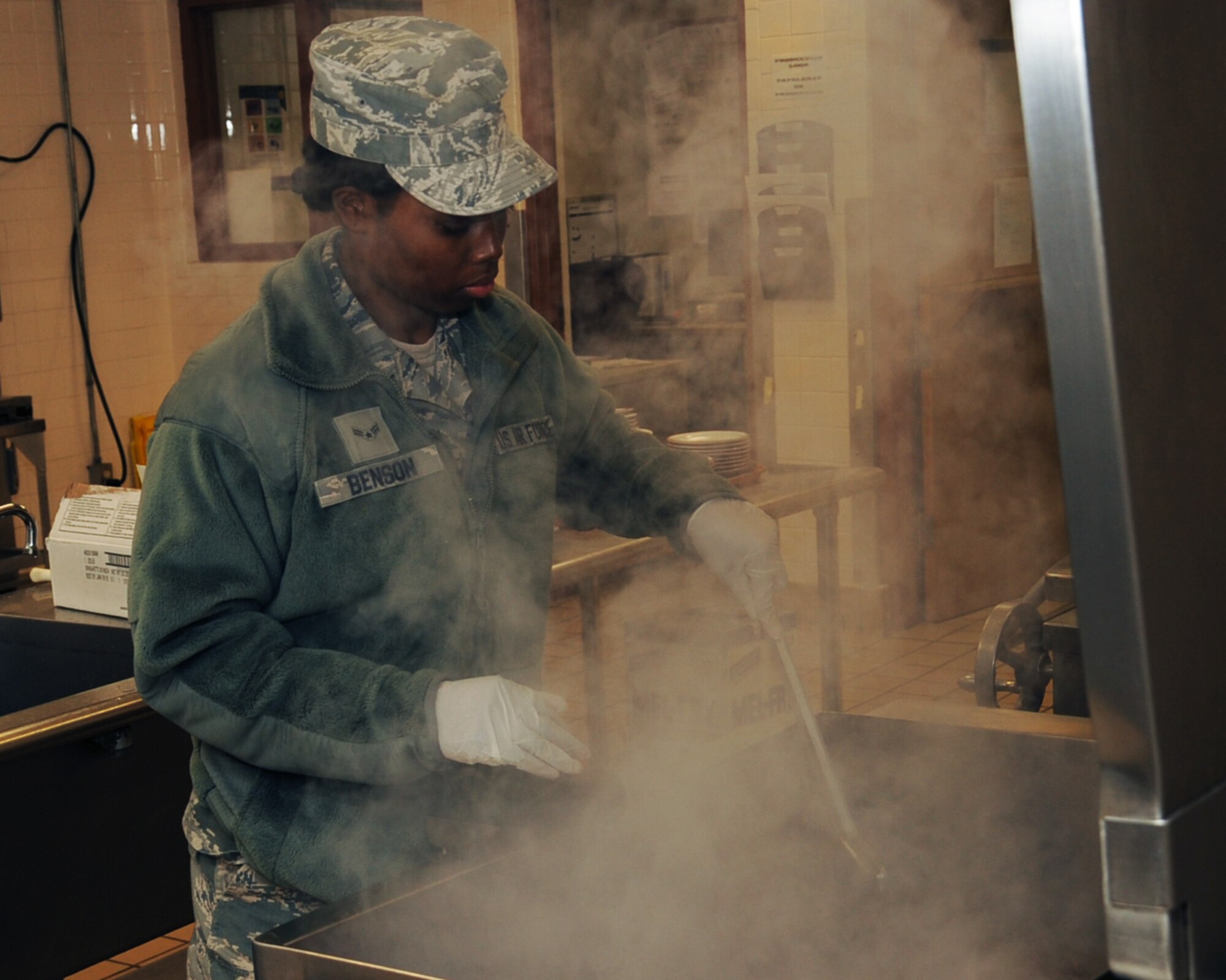 Airman 1st Class Neosha Benton, 307th Force Support Squadron food service specialist, prepares a meal at the Red River Dining Facility on Barksdale Air Force Base, La., March 26.  The goal of the DFAC is to provide the highest quality of food possible along with top notch service. (U.S. Air Force photo/Senior Airman Sean Martin)