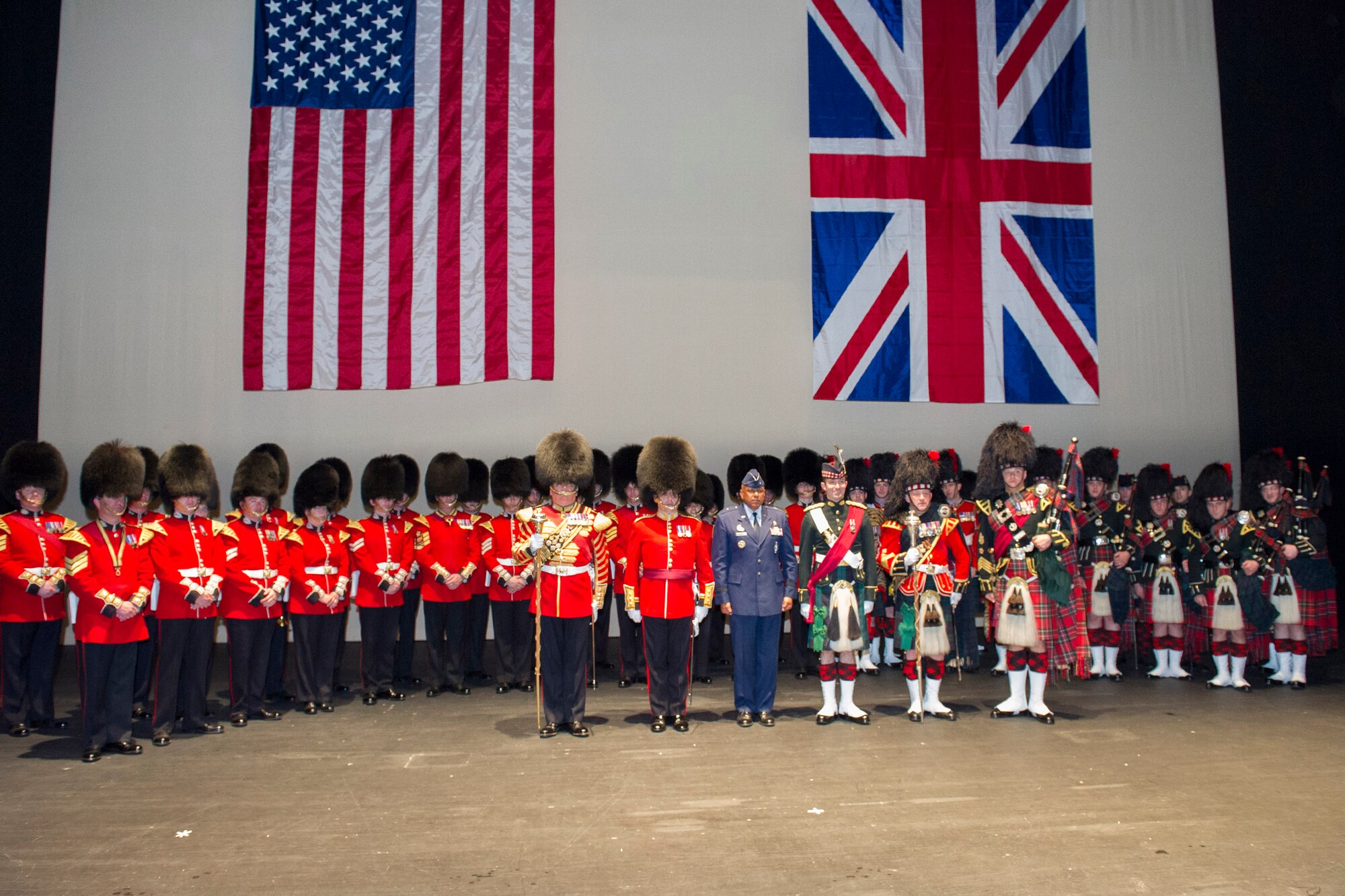 Brig. Gen. Anthony Cotton, 45th Space Wing commander, joins the Pipes and
Drums of the Black Watch and the Band of the Scots Guards on stage during
their performance at the King Center March 23.  (Photo by Matthew Jurgens)
