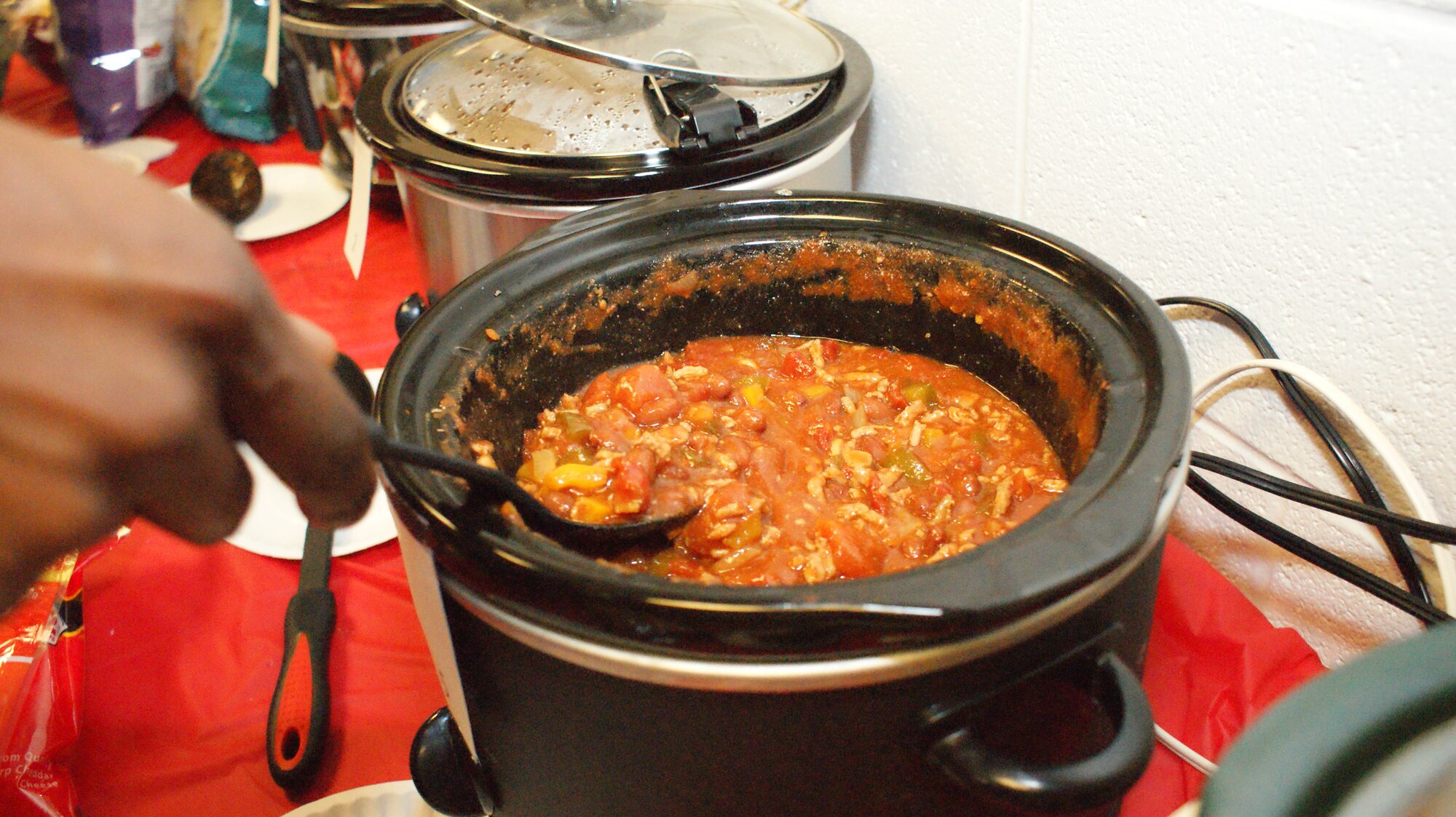 Airmen in the 914th Logistics Readiness Squadron prepare for their annual chili cook-off competition during the February Unit Training Assembly here. A major aspect of the competition was to allow the LRS Airmen to get to know each other better, with the hope to become better Wingmen. (U.S. Air Force photo by Senior Airman Jonathan Perez)