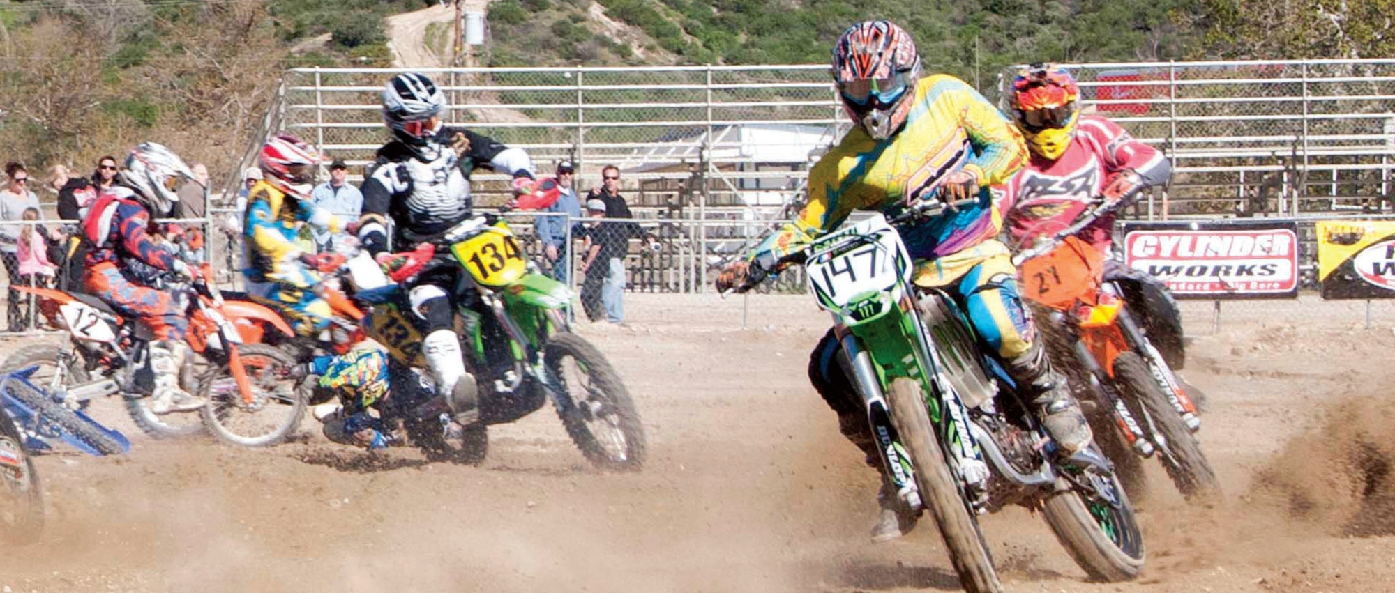 The California Guard competed at the Southern California Glen Helen Raceway, in a six-hour motocross endurance relay race, March 10. Senior Airman Jarrett Smith,  163d Reconnaissance Wing, shown with the number ‘147’ emblazoned across the front of the handlebars, maneuvered through a maze of hills and dips resulting in a second place team fi nish. (Air National Guard photo by Master Sgt. Julie Avey)