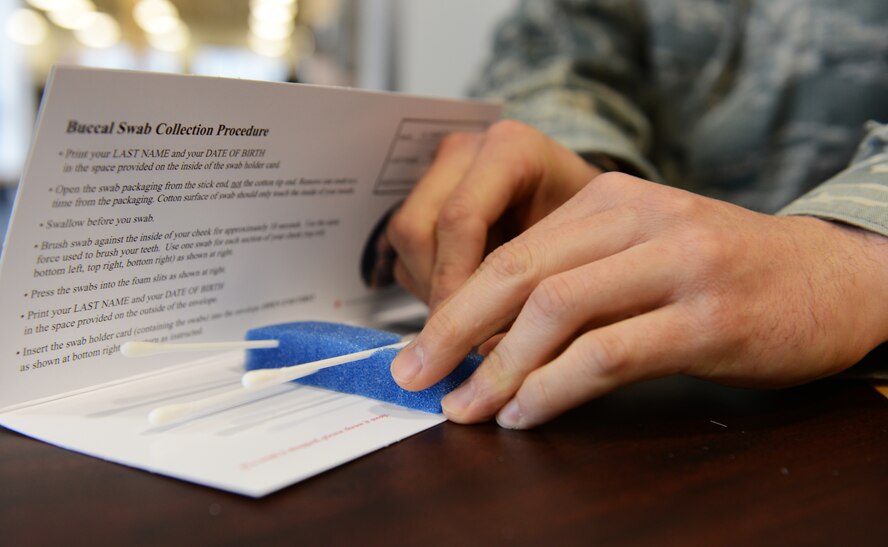 Four cotton swabs collect saliva samples from four corners of each registrants' mouth for the C.W. Bill Young Department of Defense marrow donor program at the fitness center, Shaw Air Force Base, S.C., March 22, 2013. During the week of March 18, 1,195 Team Shaw members registered for the C.W. Bill Young DoD marrow donor program to help save lives of those in need of bone marrow and/or stem cells. (U.S. Air Force photo Senior Airman Tabatha Zarrella/Released)
