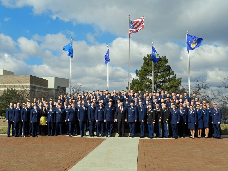 Air Force Institute of Technology Chancellor, Dr. Todd Stewart, stands center amongst the AFIT class of 2013. AFIT classes are composed of military, international, civilian and contractor students. (U.S. Air Force photo)