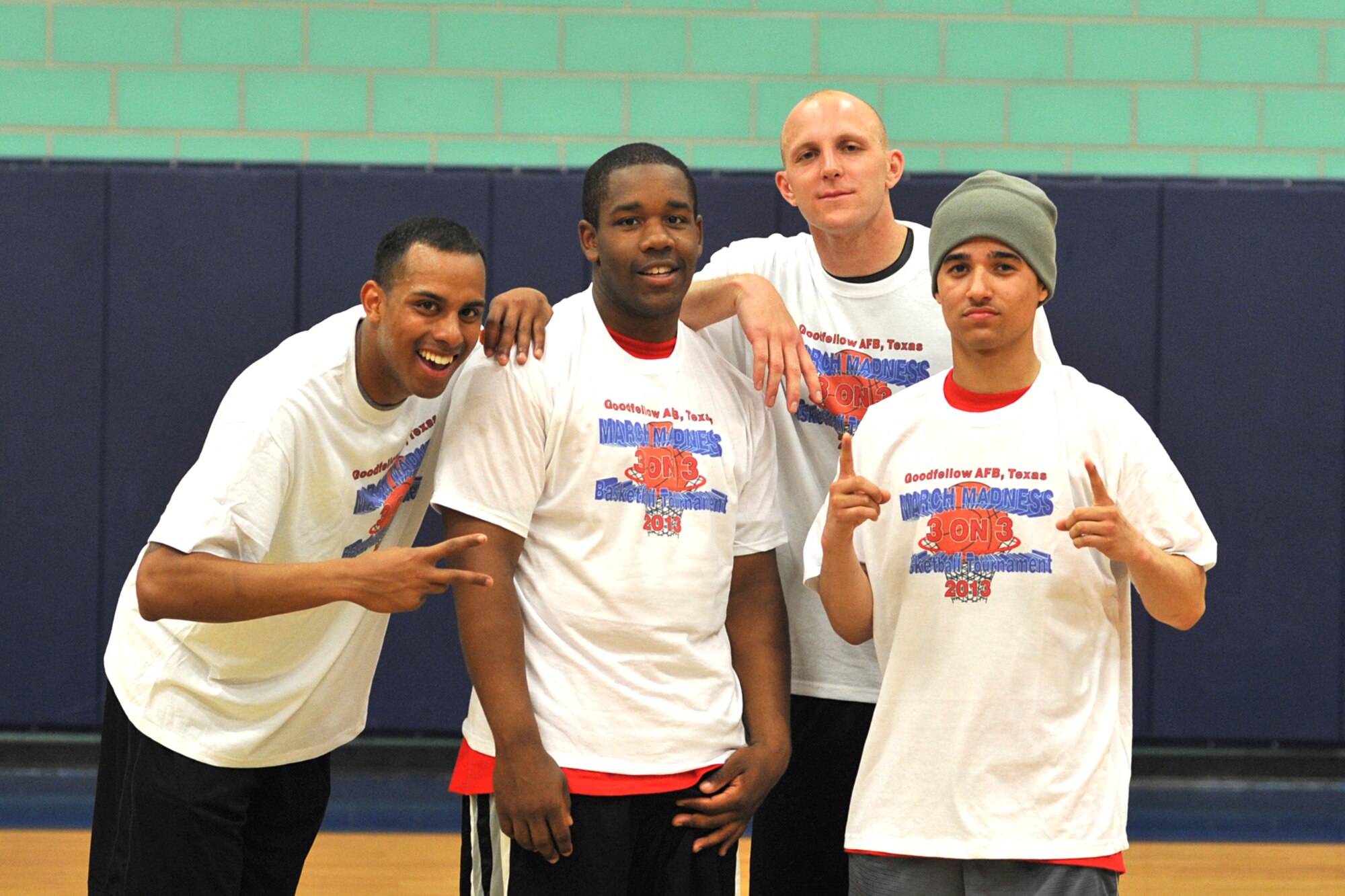 GOODFELLOW AIR FORCE BASE, Texas -- Michael Waller, Chad Trail, Brandon Roberts, 169th Engineer Battalion students, and Isaiah Sweeney, 344th Military Intelligence Battalion student, pose for a photo after winning second place in the 3-on-3 March Madness Basketball Tournament at Mathis Fitness Center March 22. The 15 teams faced head to head in a double elimination tournament with 15 minutes on the clock to see who would win it all. (U.S. Air Force photo/ Airman 1st Class Michael Smith)