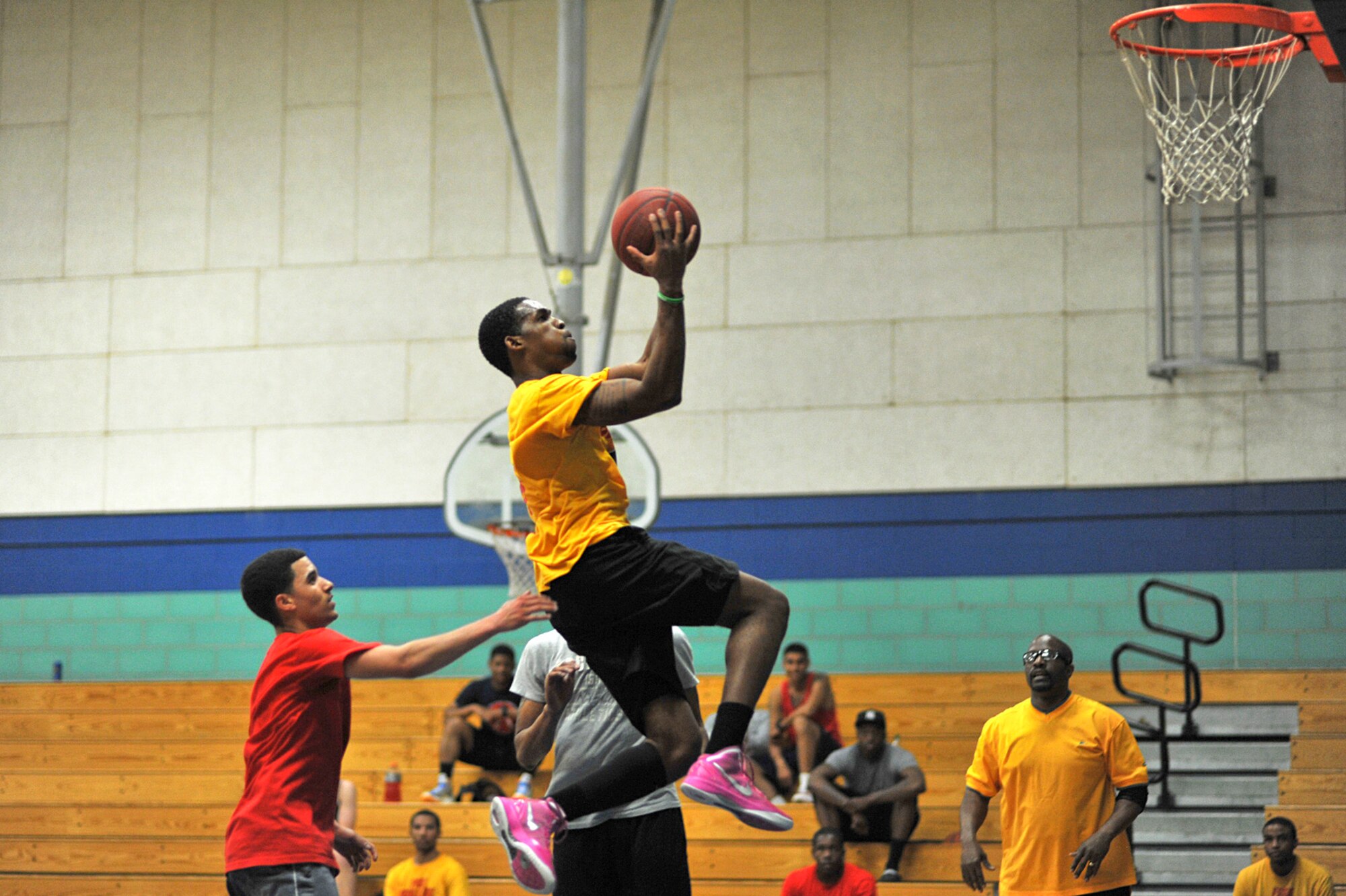 GOODFELLOW AIR FORCE BASE, Texas -- Andre Golden, 17th Training Wing Staff spouse, does a lay-up during the 3-on-3 March Madness Basketball Tournament at Mathis Fitness Center, March 22. The 15 teams faced head to head in a double elimination tournament with 15 minutes on the clock to see who would win it all. (U.S. Air Force photo/ Airman 1st Class Michael Smith)